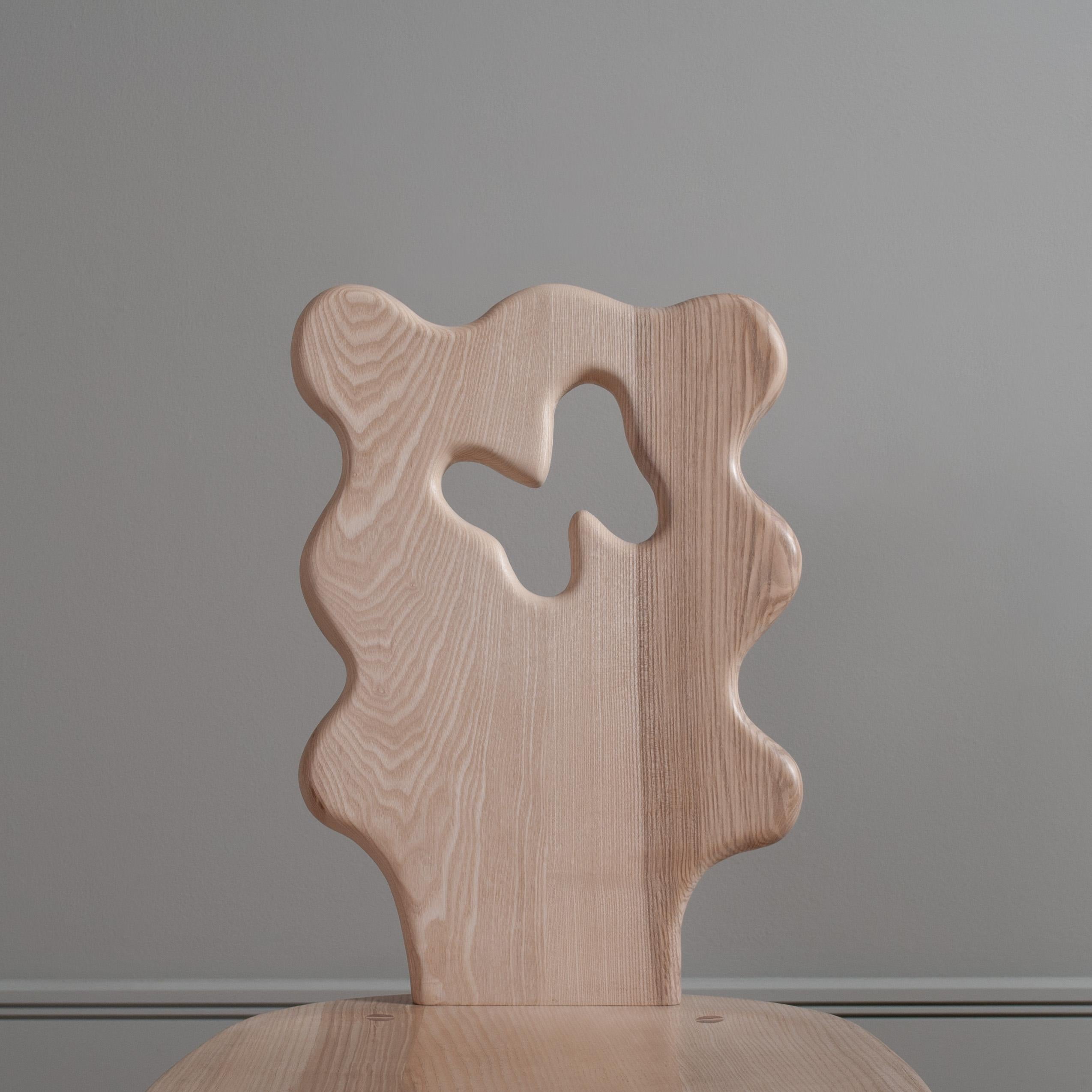 Handcrafted wavy ash dining chair.
Inspired by the Alpine style stick chairs in antiques shops around Hastings where James lives. The freehand organic, wavy shape of the back rest updates this traditional style of chair in an amusing