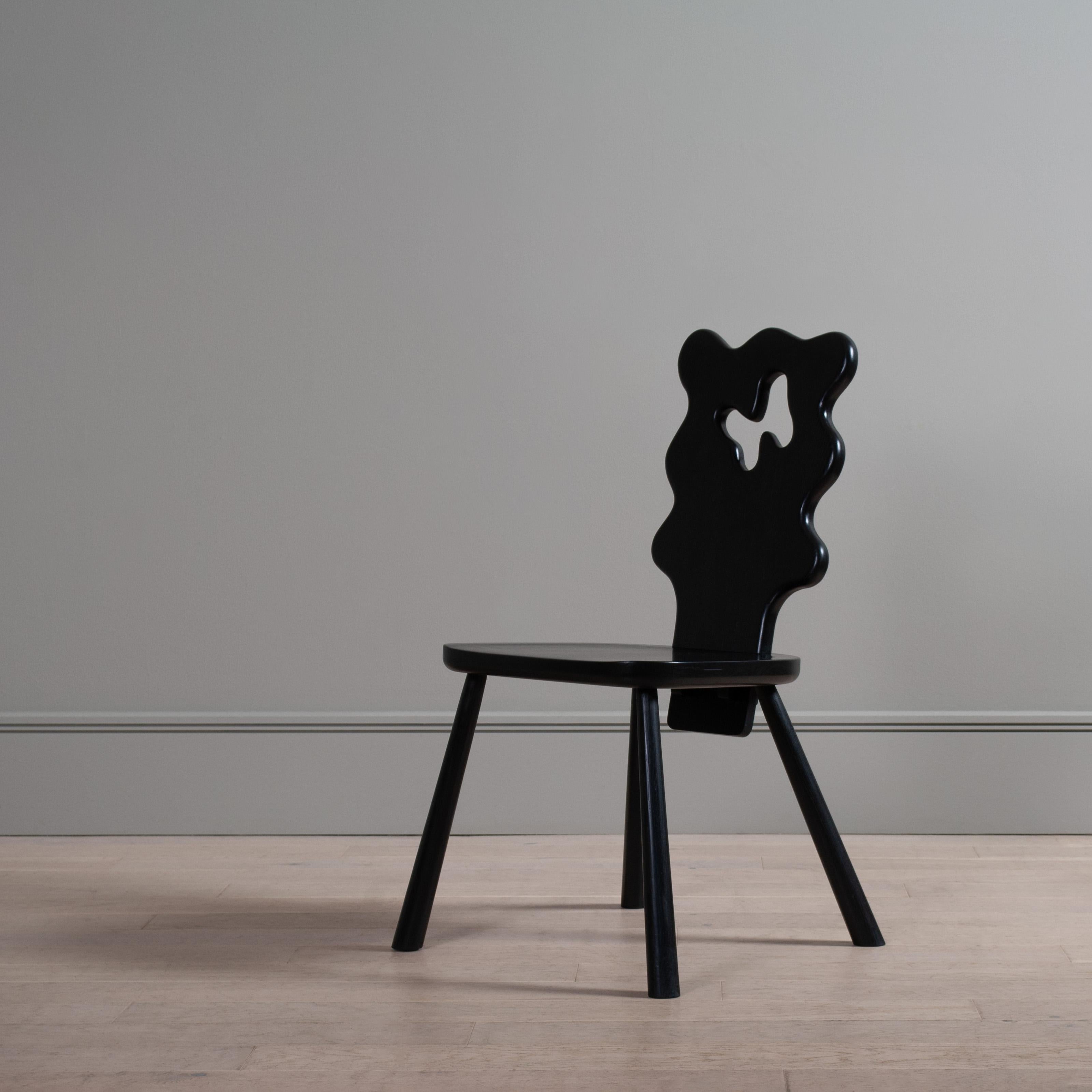 Handcrafted wavy black ash dining chair.
Inspired by the Alpine style stick chairs - the freehand organic, wavy shape of the back rest updates this traditional style of chair in an amusing fashion.

Careful attention is paid to the joinery, with