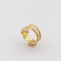 Anello "Snake" in oro giallo con diamanti taglio brillante e tsavorite, realizzato a mano