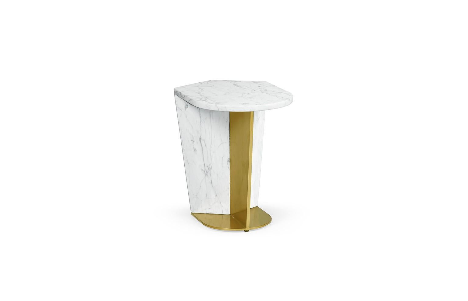 A sculptural piece with an unmistakable presence, this contemporary side table is crafted from white Calacatta marble and fully loaded brass. This luxurious  product is crafted by skilled artisans.

Materials: White Calacatta Marble,