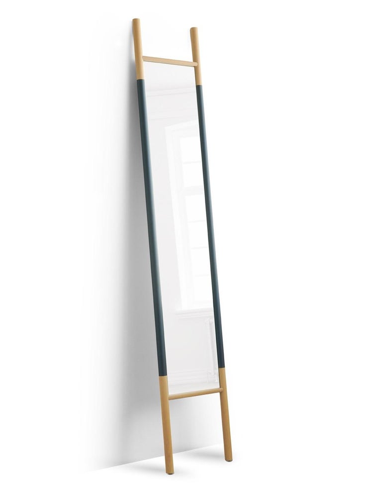 Beautiful and simple EaseUp mirror. Made of select hardwood and coated carbon steel. Rubber bumpers on the feet and a small flattened surface at the top of each leg allows one to lean this mirror just about anywhere. Available in white oak/ midnight