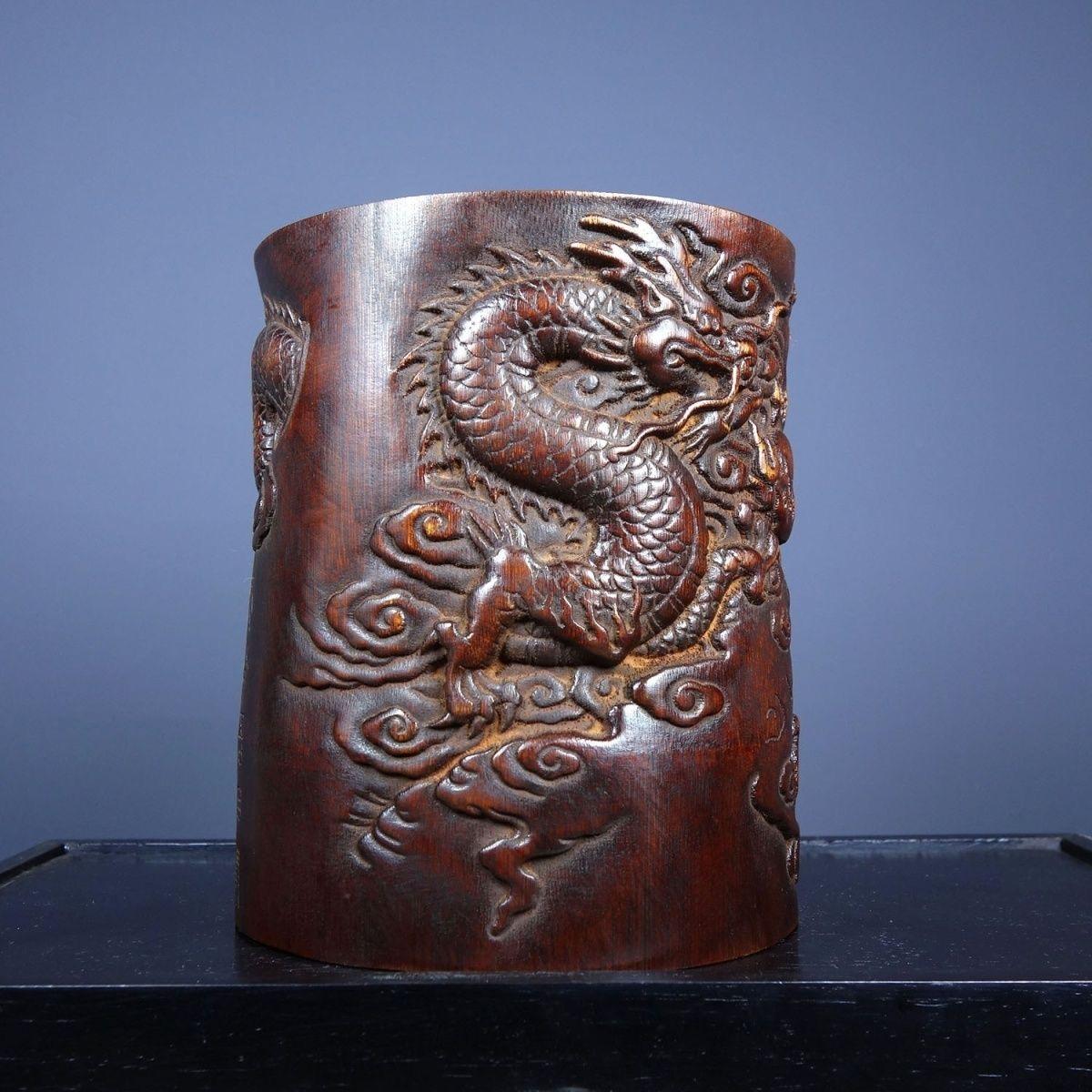Add a touch of artistry and elegance to your workspace with this handcrafted wood pen pot, featuring a stunning dragon carving. Expertly crafted from premium wood, this unique desk organizer combines functionality with intricate craftsmanship,