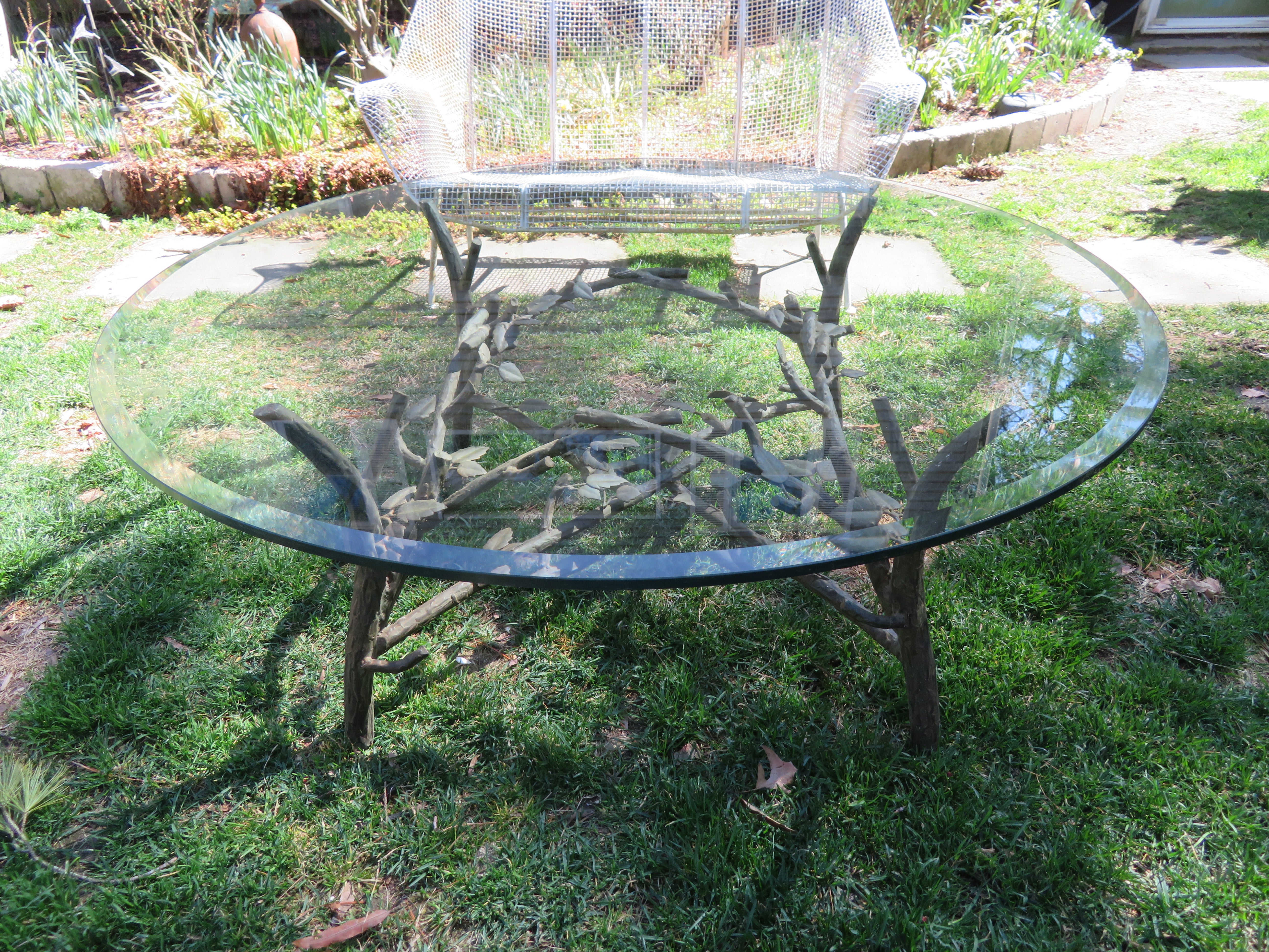 Chic faux bois coffee table in patinated metal with vined branches and leaves in the style of Diego Giacometti. The table is shown in the 1st photo with a 36