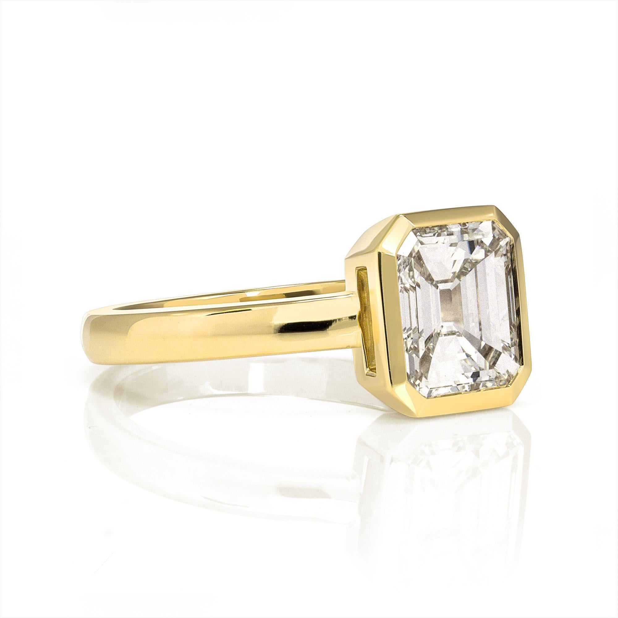 1.51ct M/VS2 GIA certified emerald cut diamond bezel set in a handcrafted 18K yellow gold mounting.