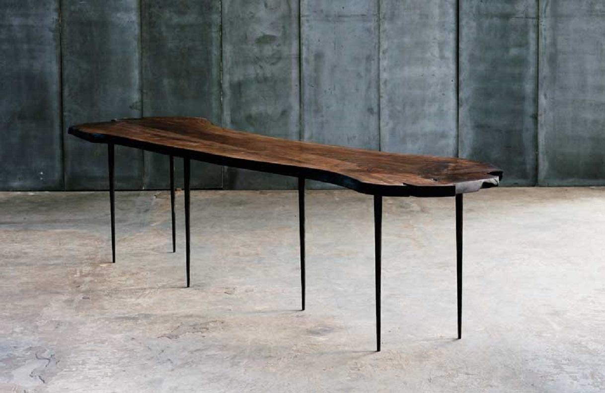 The majestic and natural shape of the Italian walnut wood lets the details in its various and unique textures and patterning charm any space. This woodwork is handcrafted uniquely with hand-welded metal table legs.
Made to measure table, where