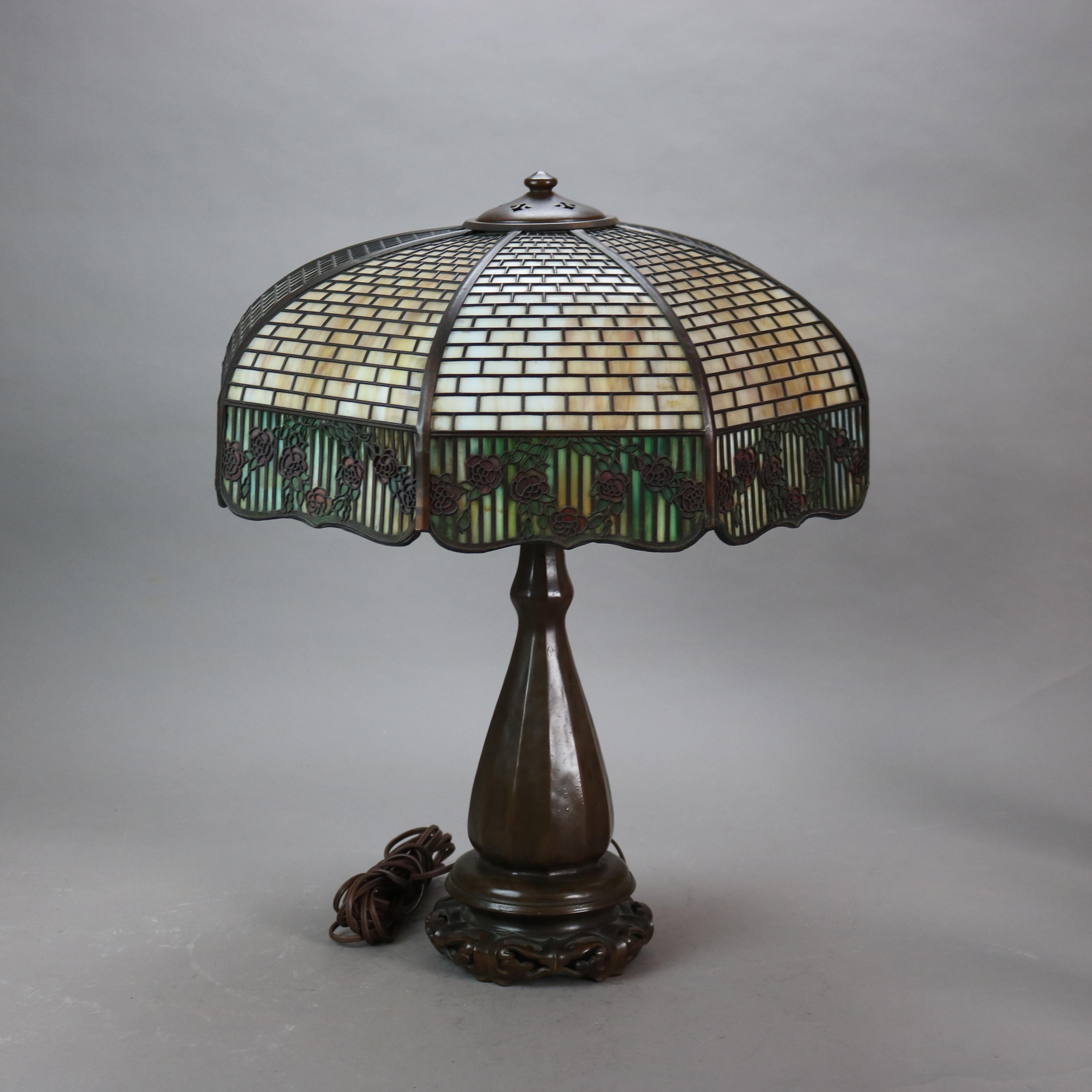 Handel Arts & Crafts Bronze Overlay Table Lamp with Shade Having Two-Tone Slag Glass and Painted Rose Elements c1920

Measures - 23 1/2