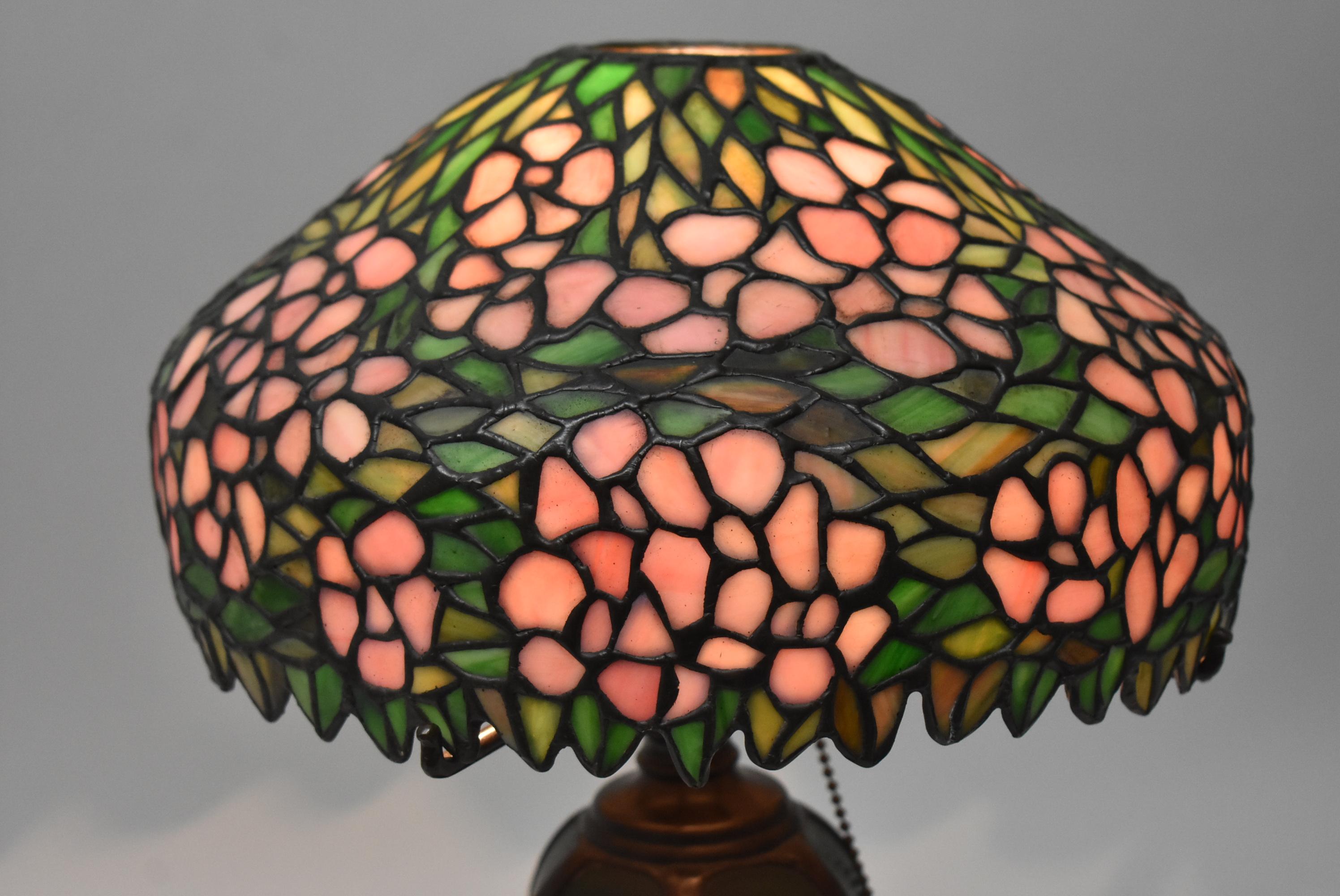 This stunning Handel Cherry Blossom leaded glass lamp is circa 1910. The 12