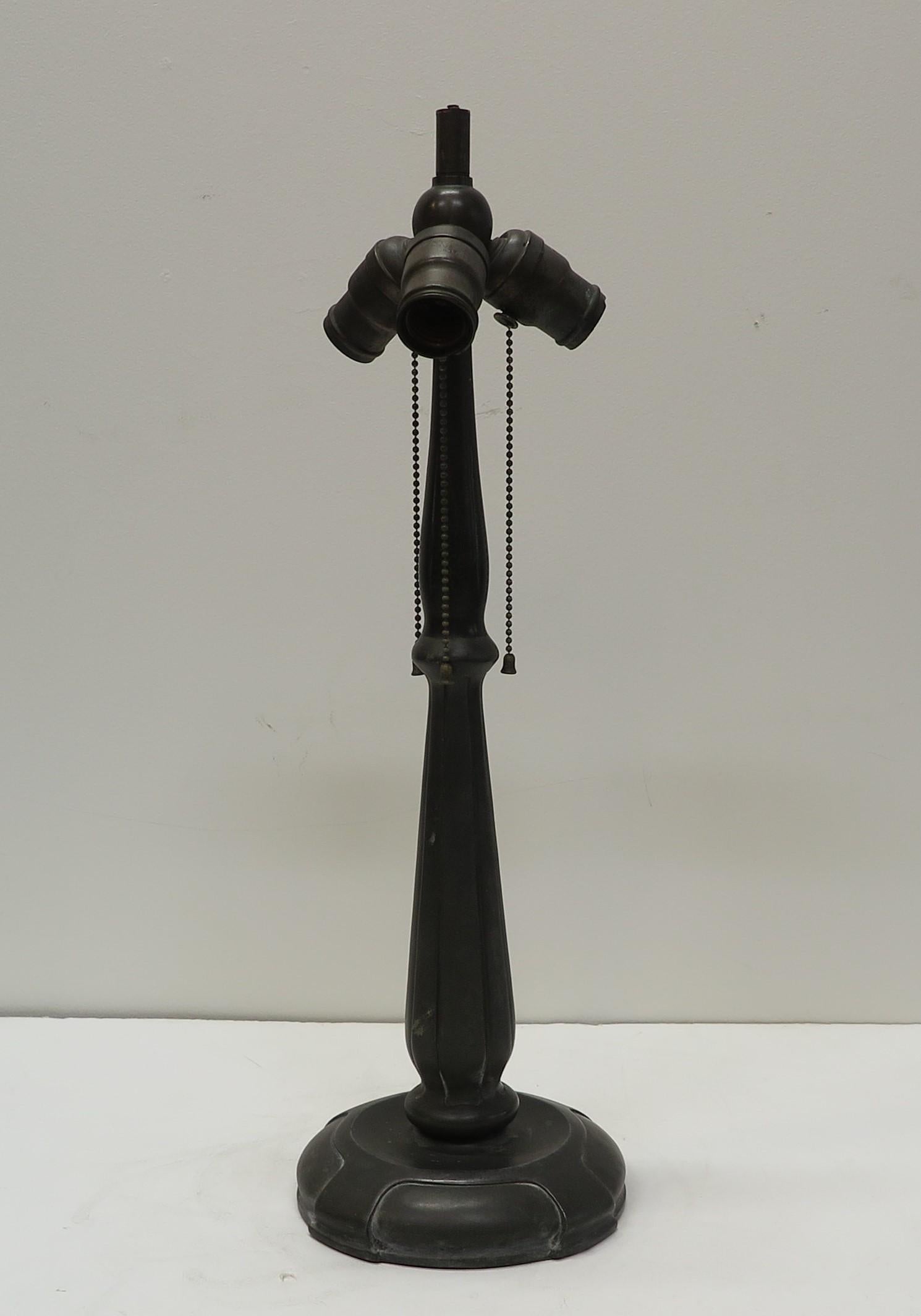 Handel Bronze Table Lamp. Handel Bronze cast Table Lamp with rare signature stamped on the side of the lower base. This Handel mark is not seen often indicates early production. Lamp maintains original sockets and wire. In good original working