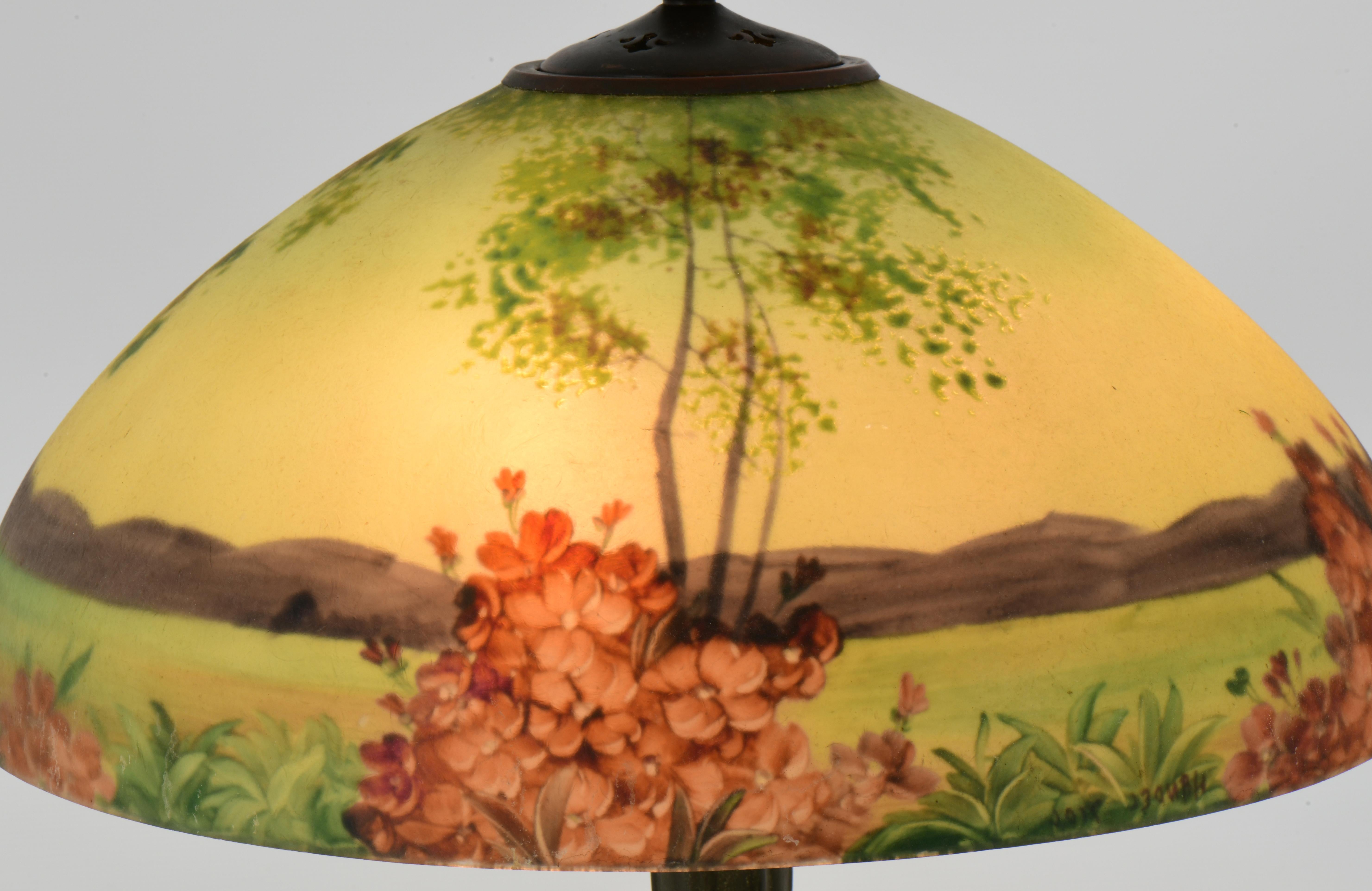 Maker: Handel Company
Type: Landscape table lamp
Circa: 1915
Materials: Reverse painted glass, patinated metal
Shade Marked: 