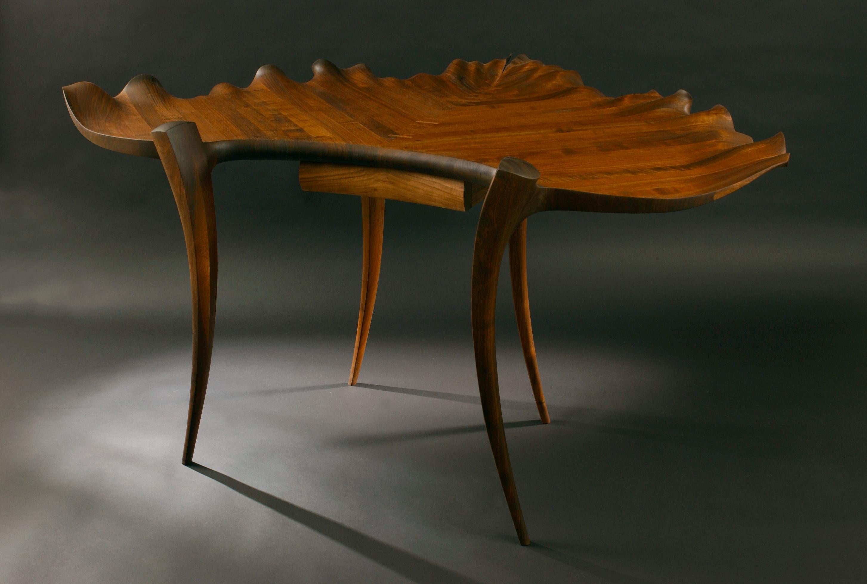 Beethoven is green with envy

The Handel Leaf Desk is a work from the artist's Leaf Table Series, from which several leaf tables are in various museum permanent collections. 

Two seven-inch thick laminated walnut sections, each weighing nearly