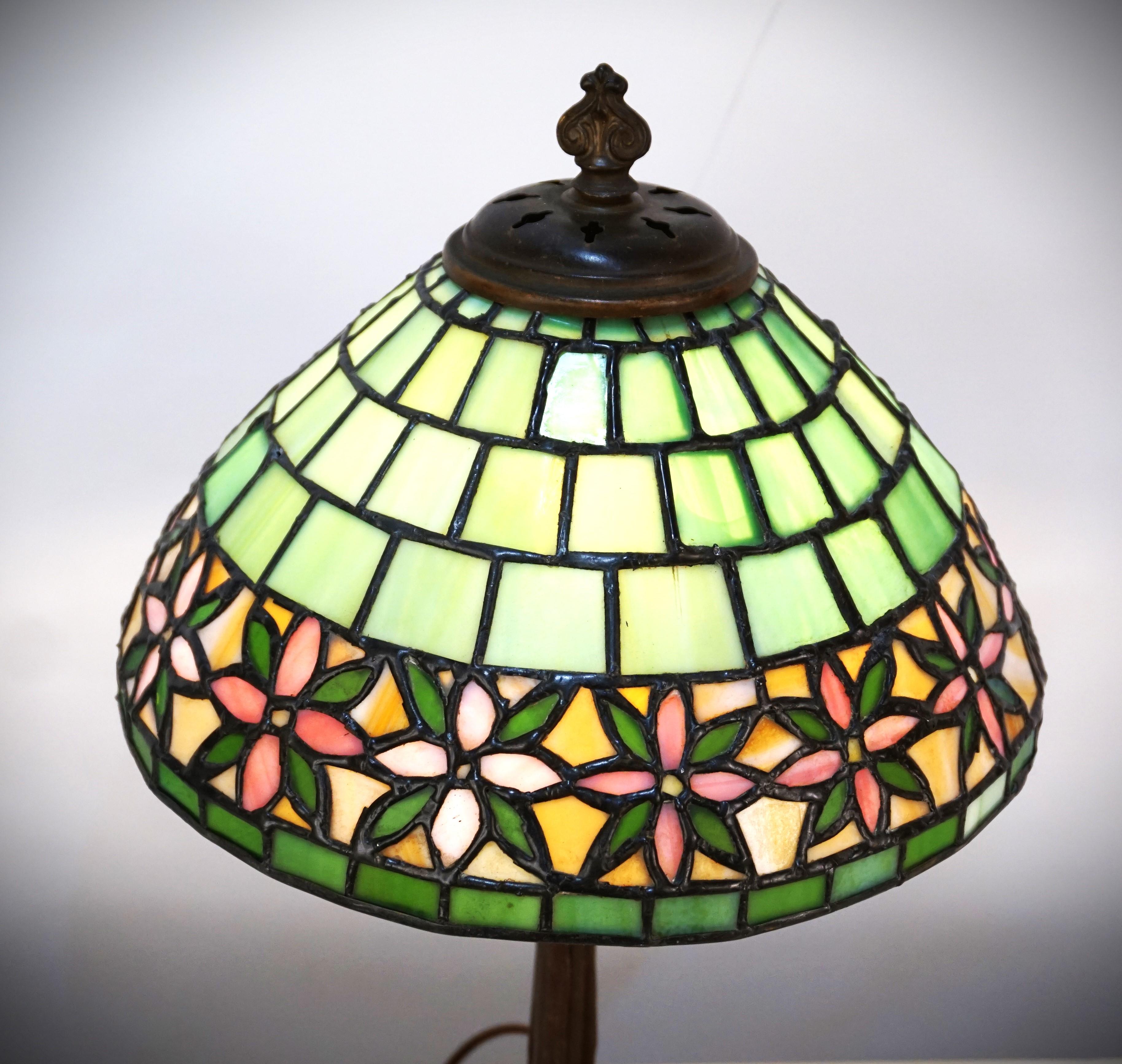 American green, pink and beige color-stained glass table lamp Marked inside the shade Handel.
New wiring.