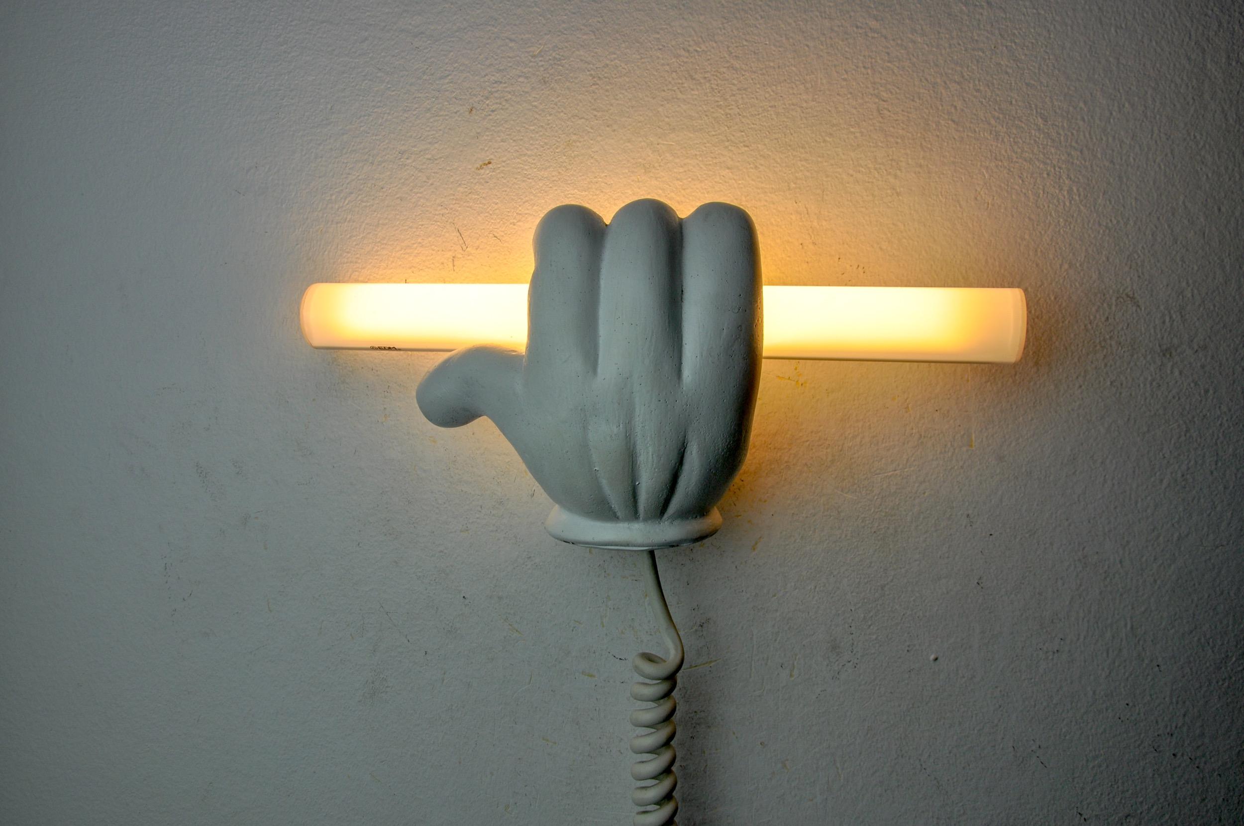 Superb and rare wall lamp representing the hand of mickey mouse, designated and produced in france in the 1970s. Design object in plaster easy to install. A rare piece that will bring a real pop touch to your interior. Electricity checked, good