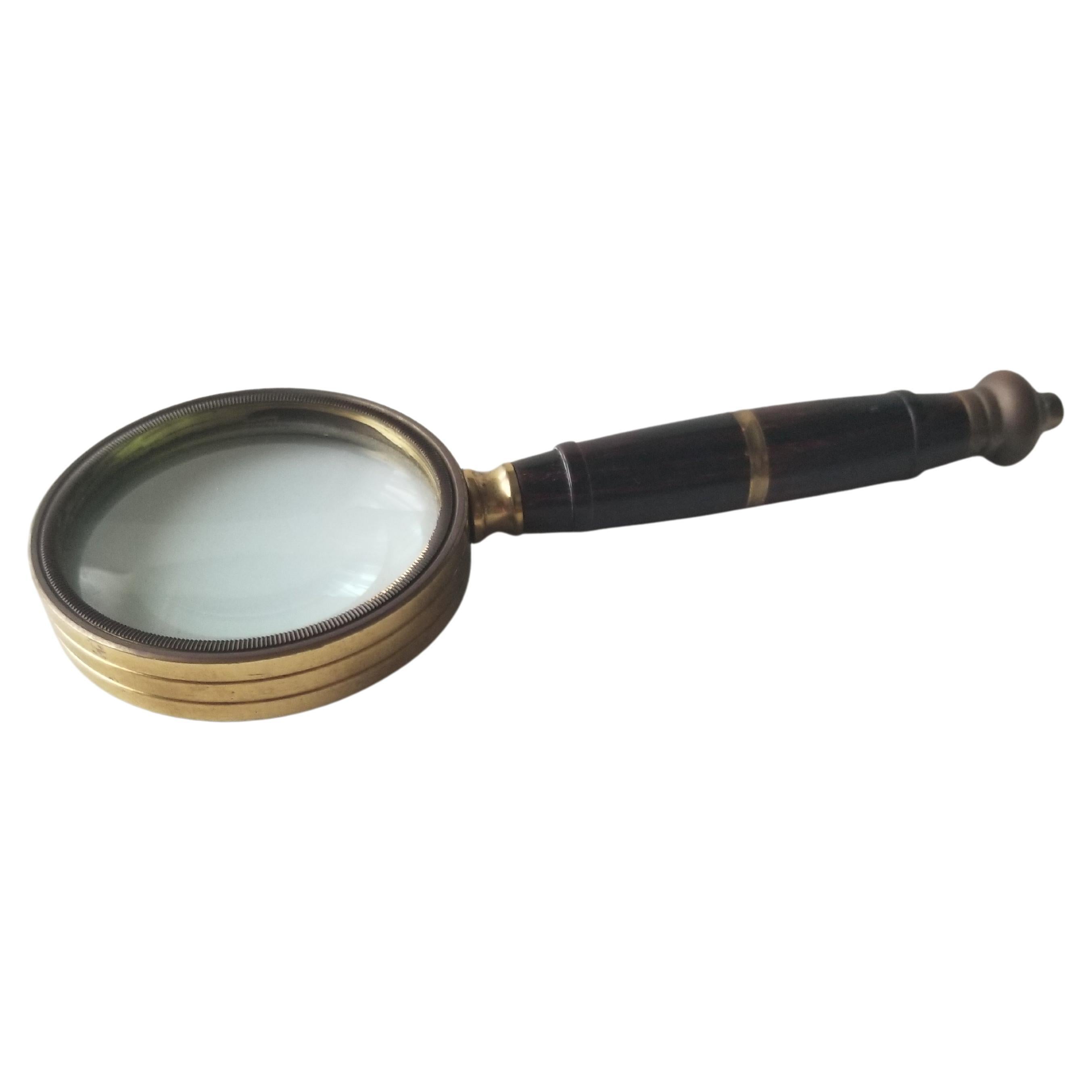 Magnifying Glass Petite
Lovely Petite Magnifying Glass Antique Vintage Braided Sculptural Brass with Wood Finish 
Measures: 5.5 L x 2 W x .5 thick
Preowned original unrestored vintage condition.
Refer to images provided.