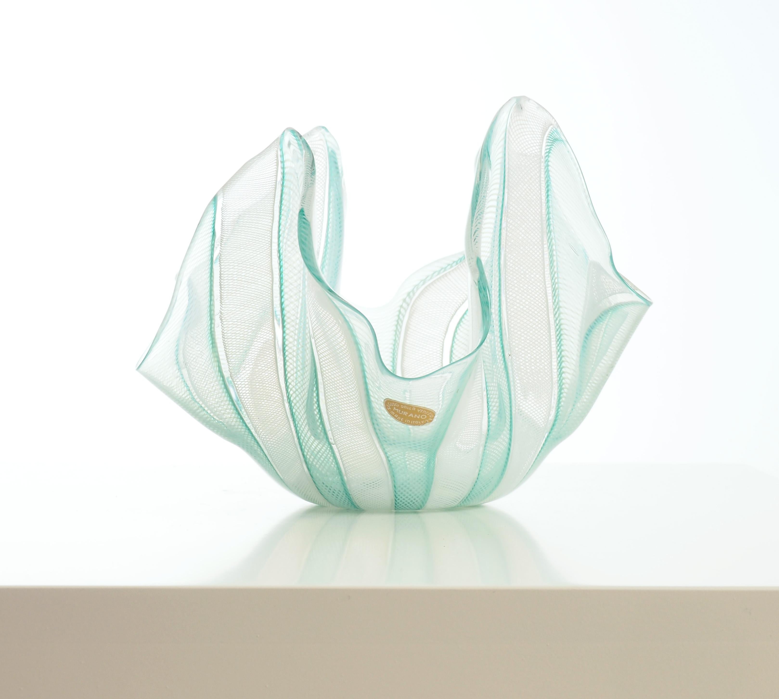 Handkerchief bowl, made at Seguso glassworks, Murano, Venice, Italy during the 1950's. 

The decoration was made in the advanced filigrana technique, this one in white and green. 