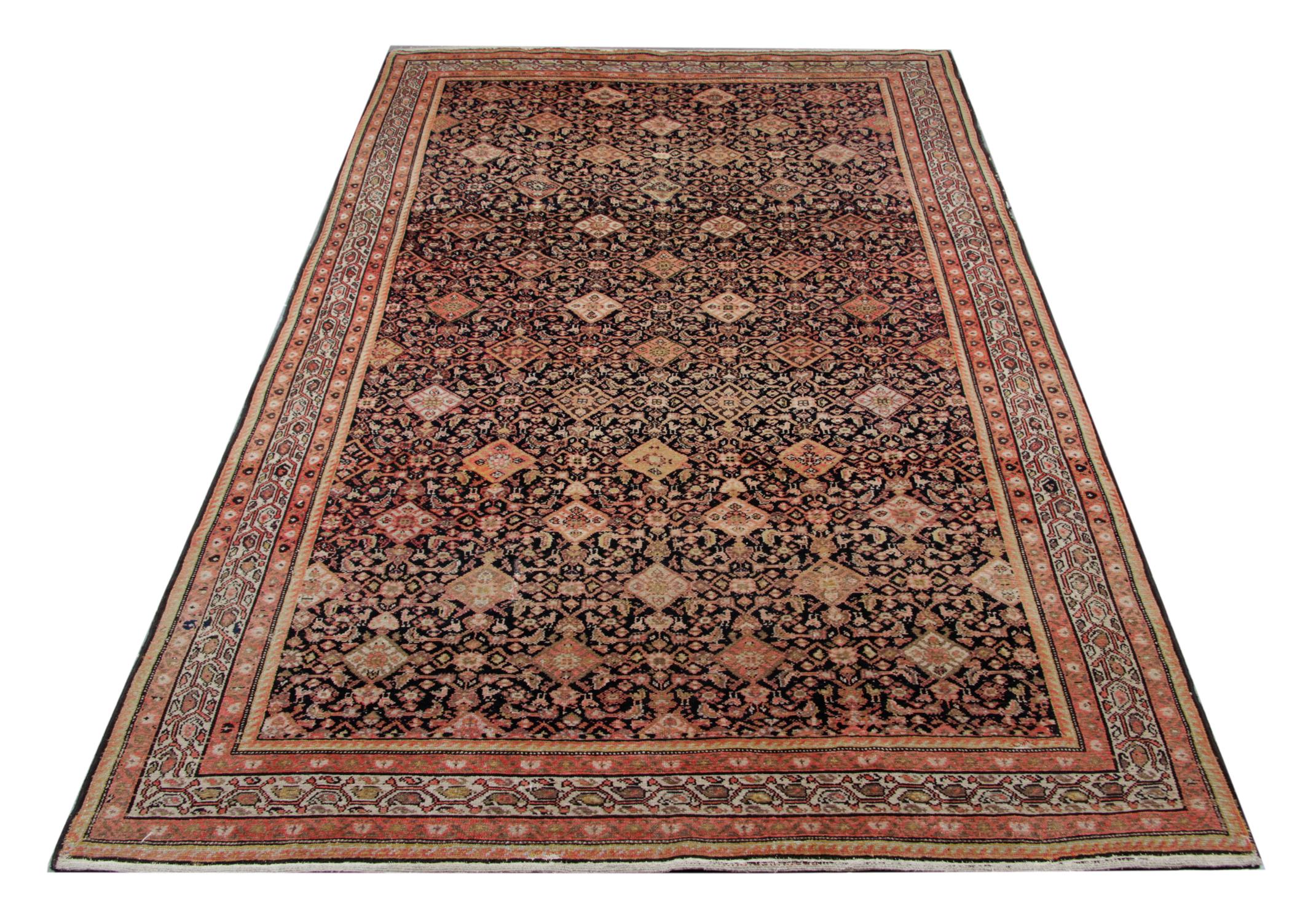 This antique rug was woven in the 1880s and features a beautifully symmetrical repeat pattern design with geometric diamond motifs. Orange and black colours contrast beautifully, creating a unique, eyecatching piece. The intricate design and
