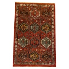 Handknotted Geometric Wool Rug with Tribal Medallions in Red, Blue, Gold 4' x 6'