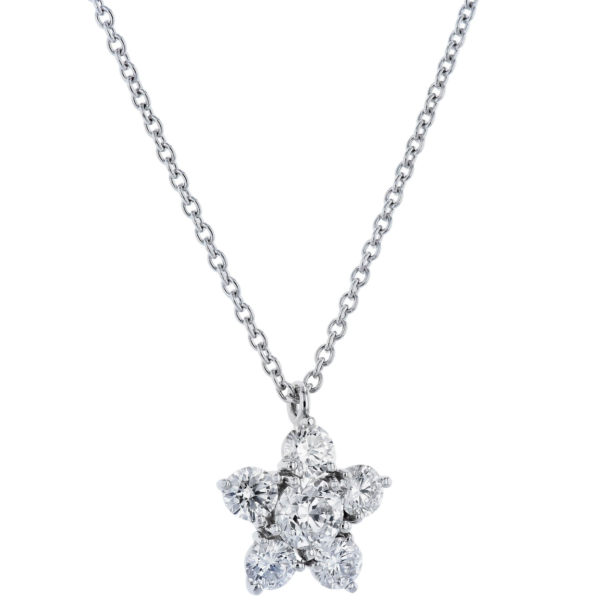 This beautiful handmade Platinum Diamond Flower Pendant has 1.35 carats total weight.
It is suspended by a platinum cable link chain that measures 15