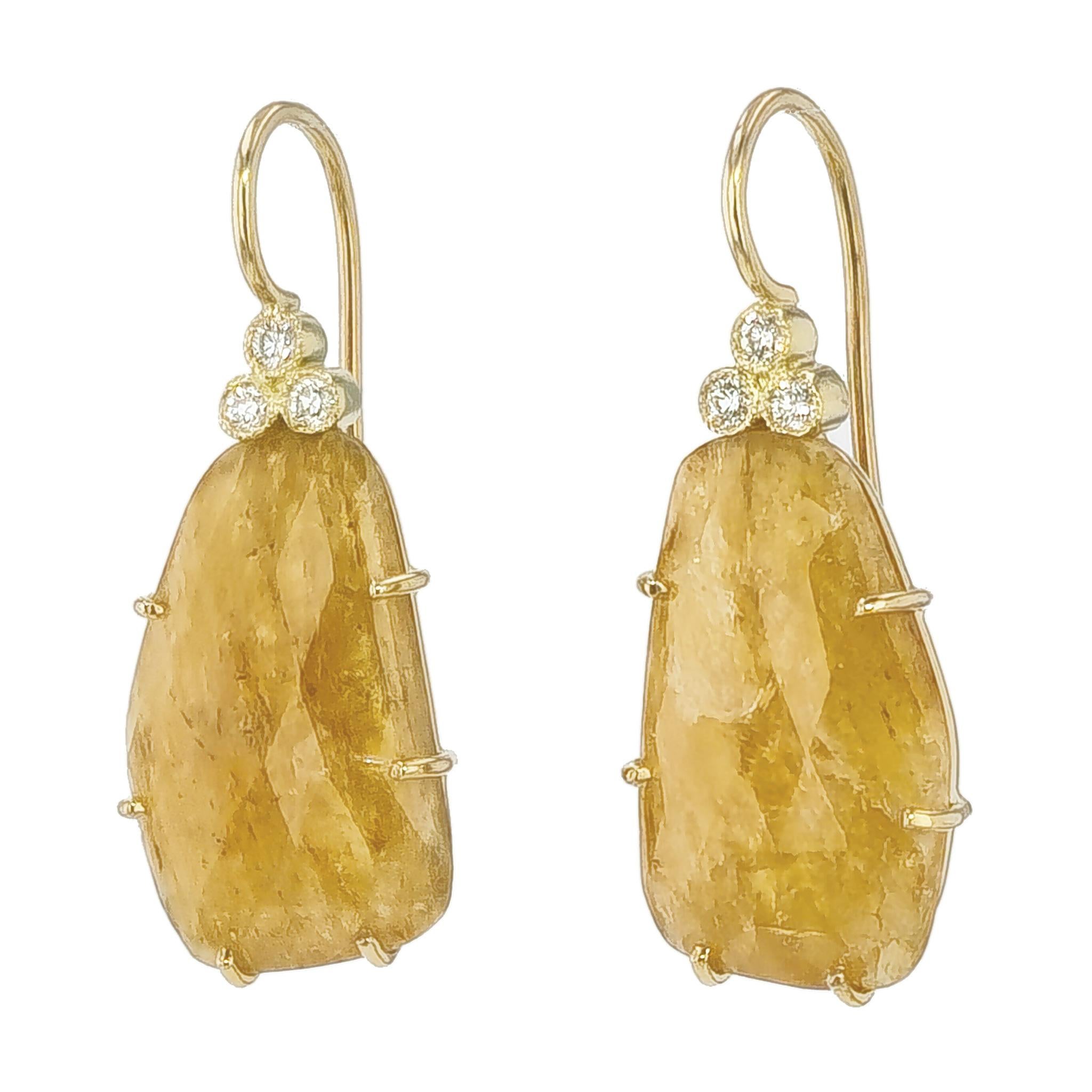 These stunning Yellow Gold Drop Earrings are handmade from the H&H Collection. 

Each pair contains two natural yellow sapphire slices with a total carat weight of 13.93ct, 6 cut round brilliant diamonds with a color grade of G-H and clarity grade
