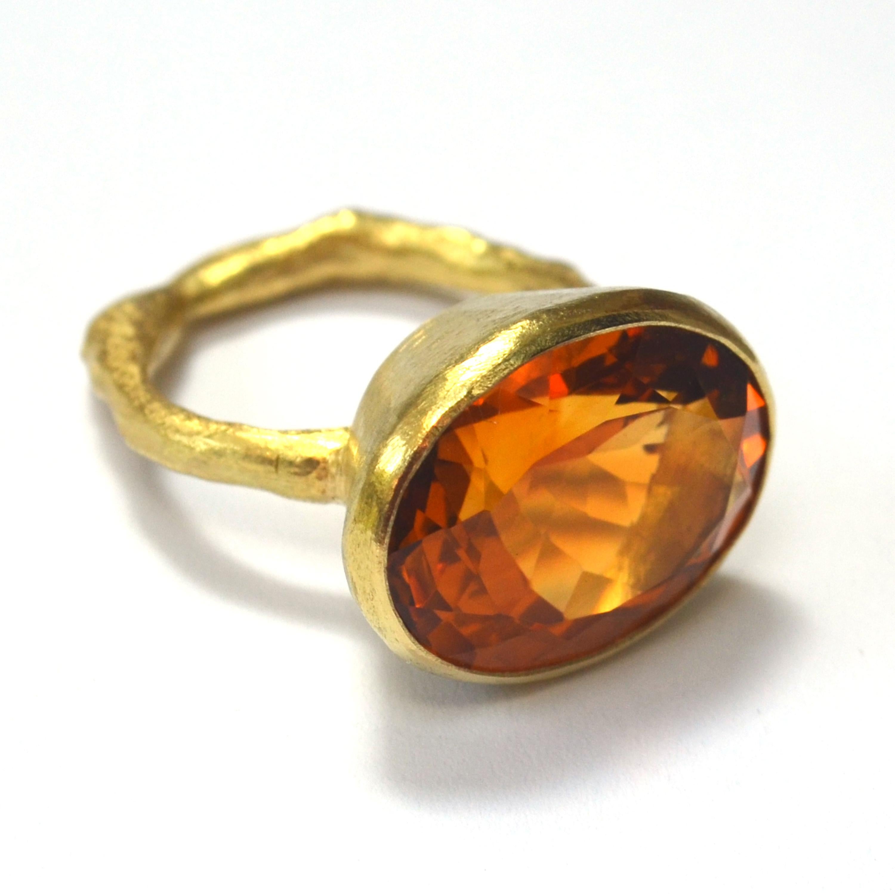 Large oval 19 carat Madeira Citrine, 16mm x 21mm in 18k yellow gold setting, 9mm depth, on organic textured 18k yellow gold band. A stunning Cocktail ring, the tones in this Citrine are warm, sherry-like browns and oranges. Disa uses reticulation