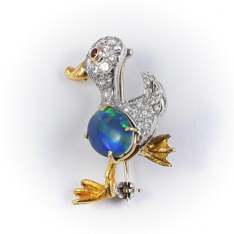 Handmade in 1980's 18k white gold duck brooch (slightly smaller than our other one) with 23 diamonds 0.8 carats, 1 ruby and 1 doublet opal. 
