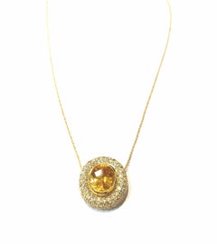 Handmade 18 Karat Yellow Gold and Diamond Pendant with a Center Yellow Sapphire