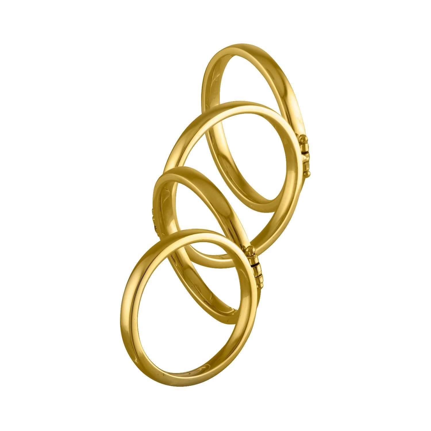 Shah & Shah's handmade 18k yellow gold hinged four finger ring.

The ring is size 9.75, 8.75, 7, 5.25. Initial sizing is complimentary and an insurance appraisal is included with your purchase.