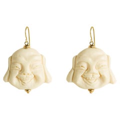 Handmade 18 Kt Gold Earrings with Bone Elements Depicting the Face of Buddha
