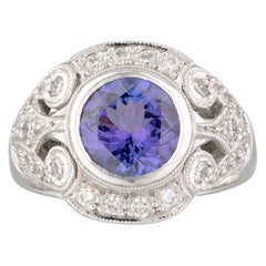 Handmade 18ct White Gold Tanzanite and Diamond Halo Scroll Style Dress Ring