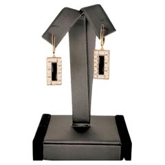 Handgefertigter Ohrring aus 18 Karat Gelbgold mit schwarzem Onyx