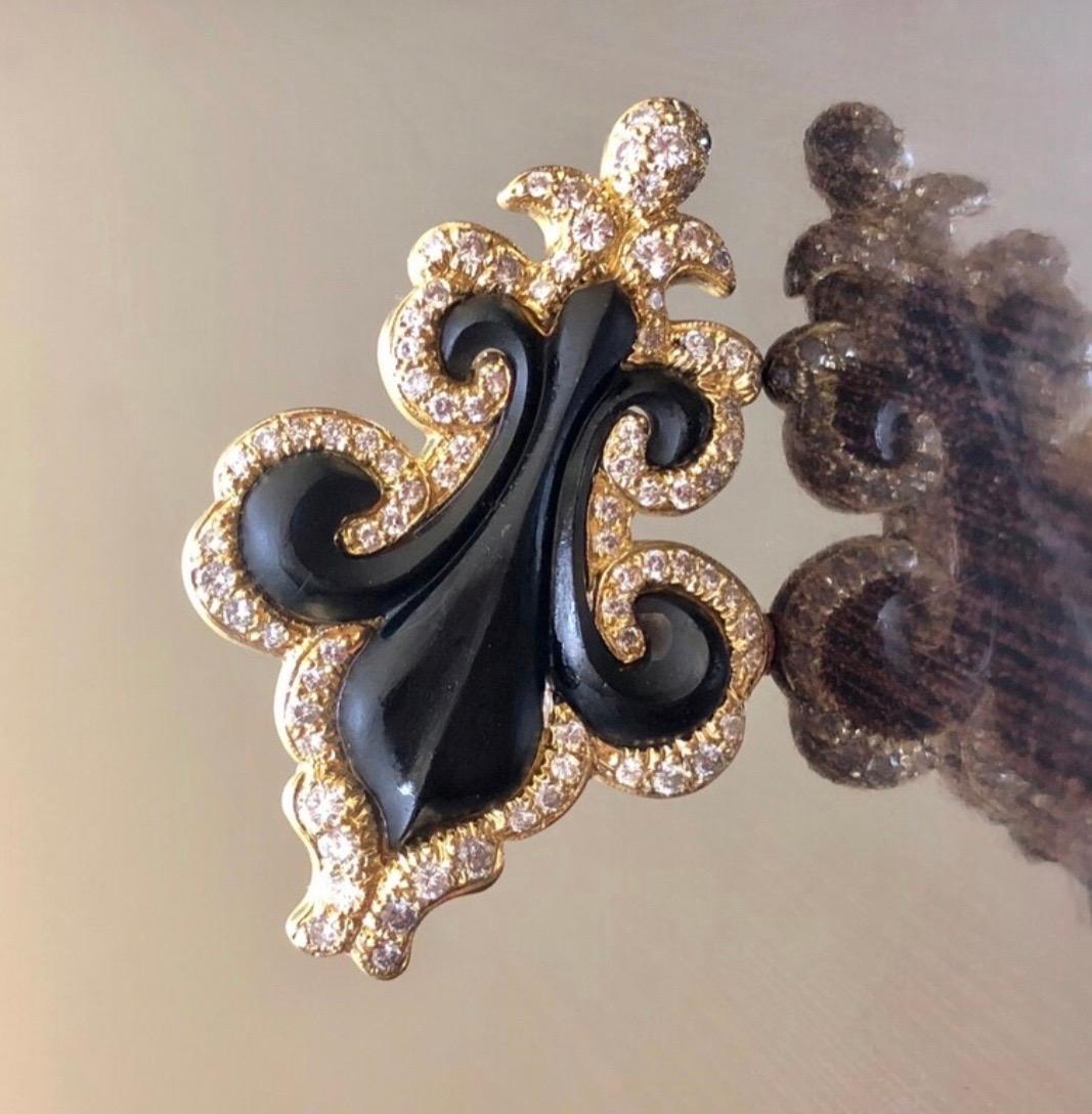 DeKara Designs Collection

Metal- 18K Yellow Gold, .750. 20 Grams

Stones- 83 Round Diamonds F-H Color, VS2-SI2 Clarity, 2.05 Carats. Natural Black Onyx.

Handmade 18K Yellow Gold Onyx Diamond Fleur De Lis Brooch/Pin. This brooch/pin is entirely