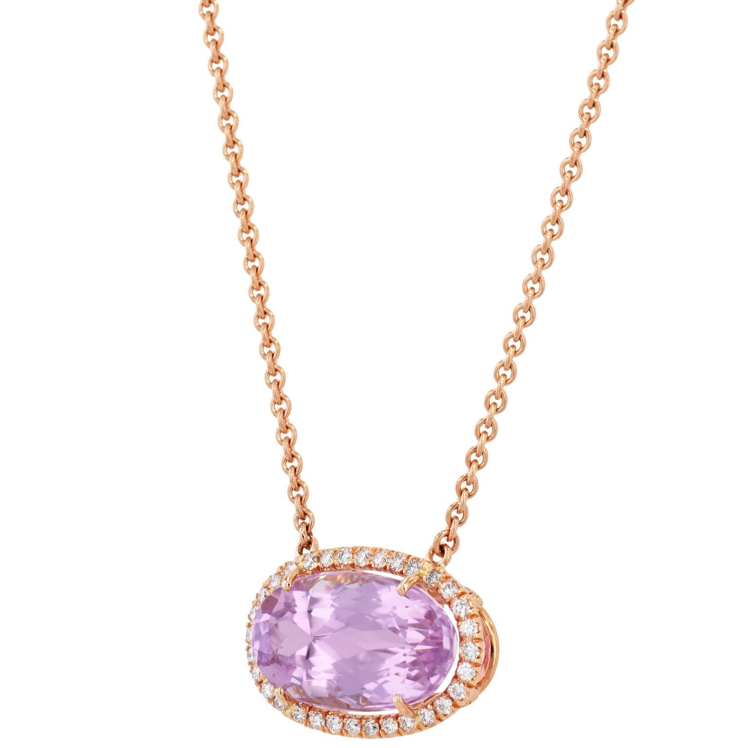 Handmade 18kt Rose Kunzite Pendant 

Handmade 18 karat rose gold Kunzite Pendant. The elongated oval Kunzite is set east to west with a total weight of 11.24 carats. The Kunzite has diamond pave set around the stone and on the basket detail with a