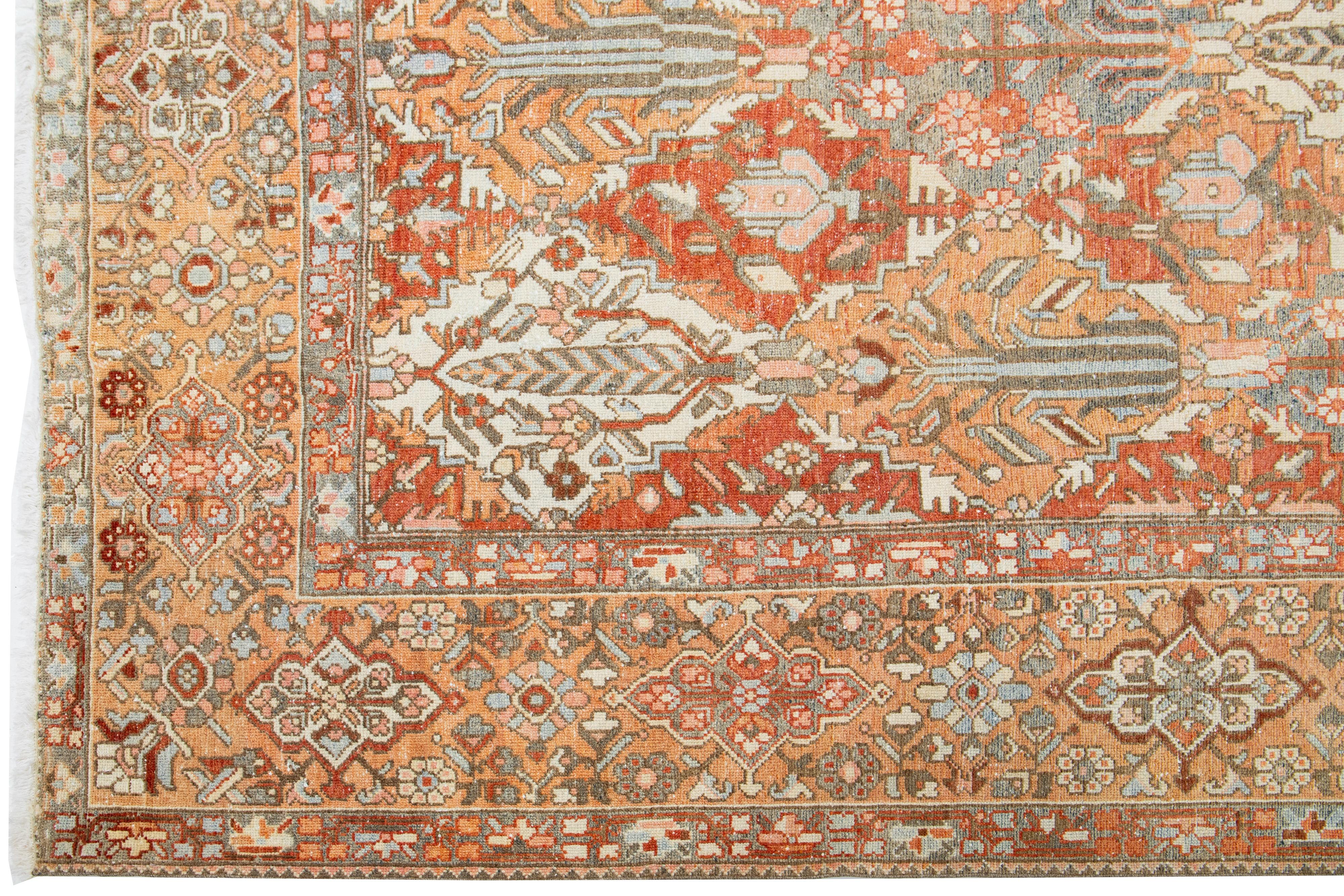 20th Century Handmade 1920s Persian Bakhtiari Wool Rug with Floral Motif In Orange  For Sale