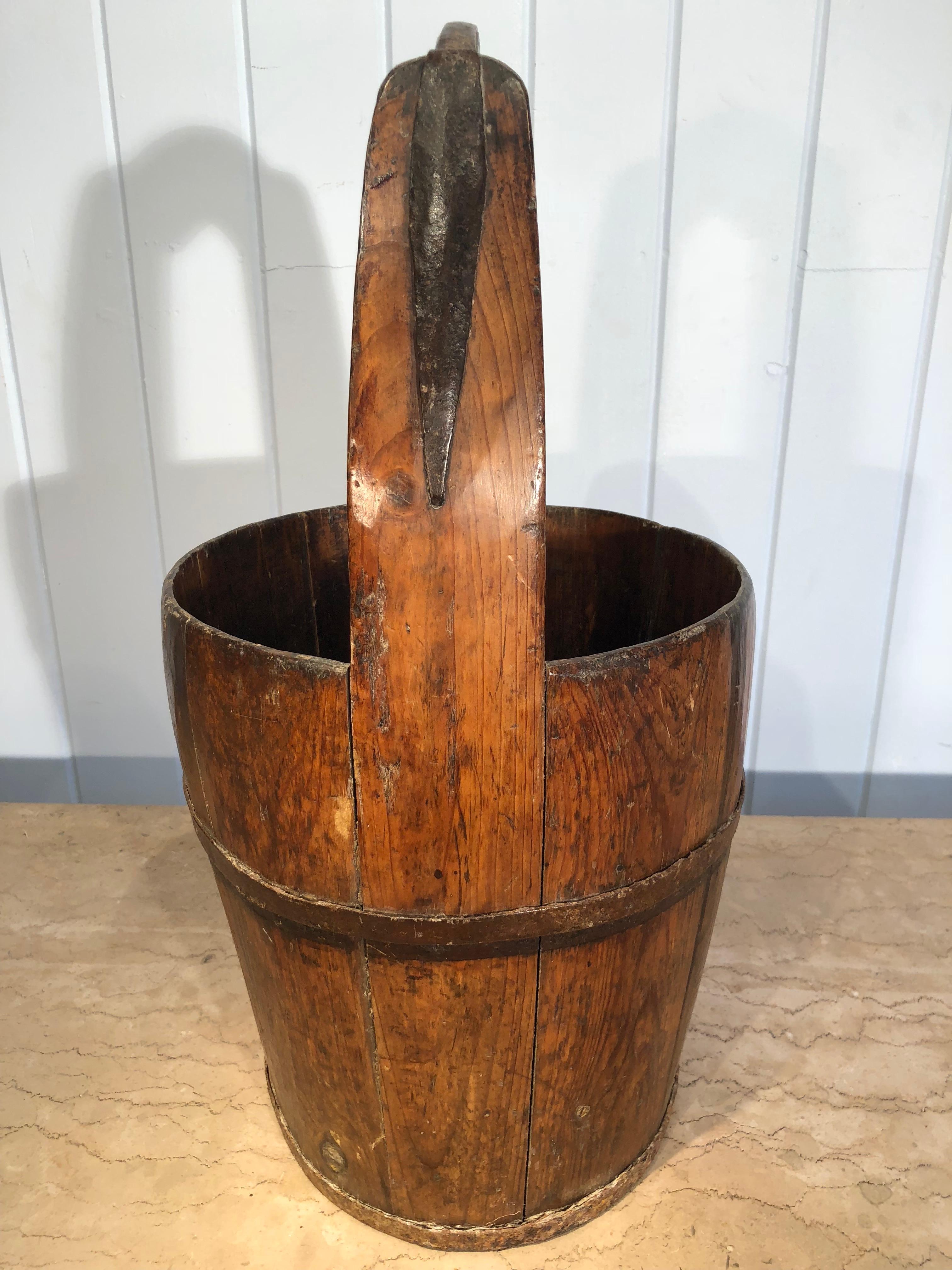We found two of these lovely hand-made oak milk buckets at our local brocante in Tournon d'Agenais, and they are beauties. We have cleaned and polished them so their deep lustrous patina shows to their best effect. They would make great decorative