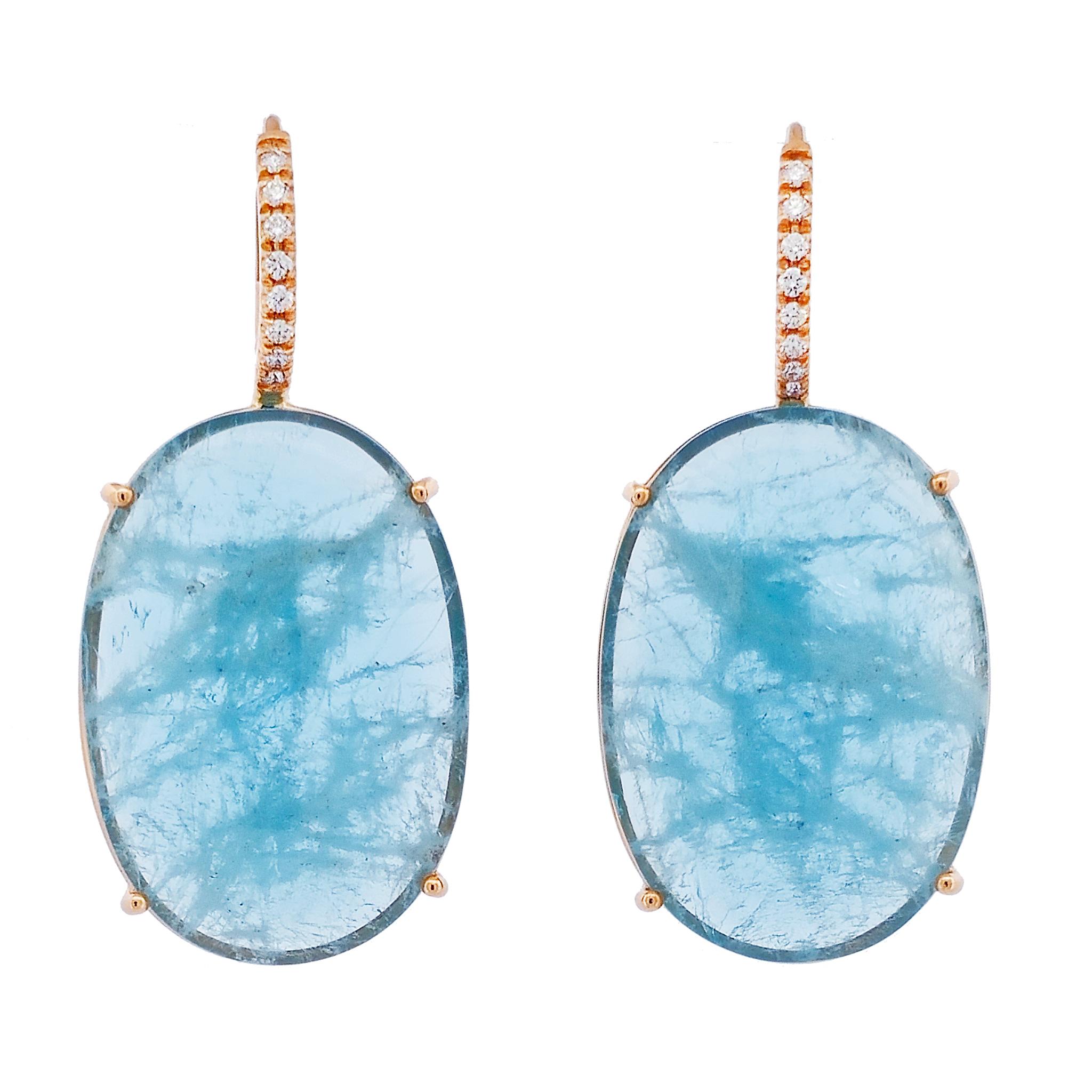 This stunning pair of aquamarine drop earrings are handcrafted with a total of 30.42 carats of cabochon cut aquamarines. There are 16 diamonds totaling 0.15 carats that are F/G in color and VS in clarity. 

These are crafted in 18 karat rose