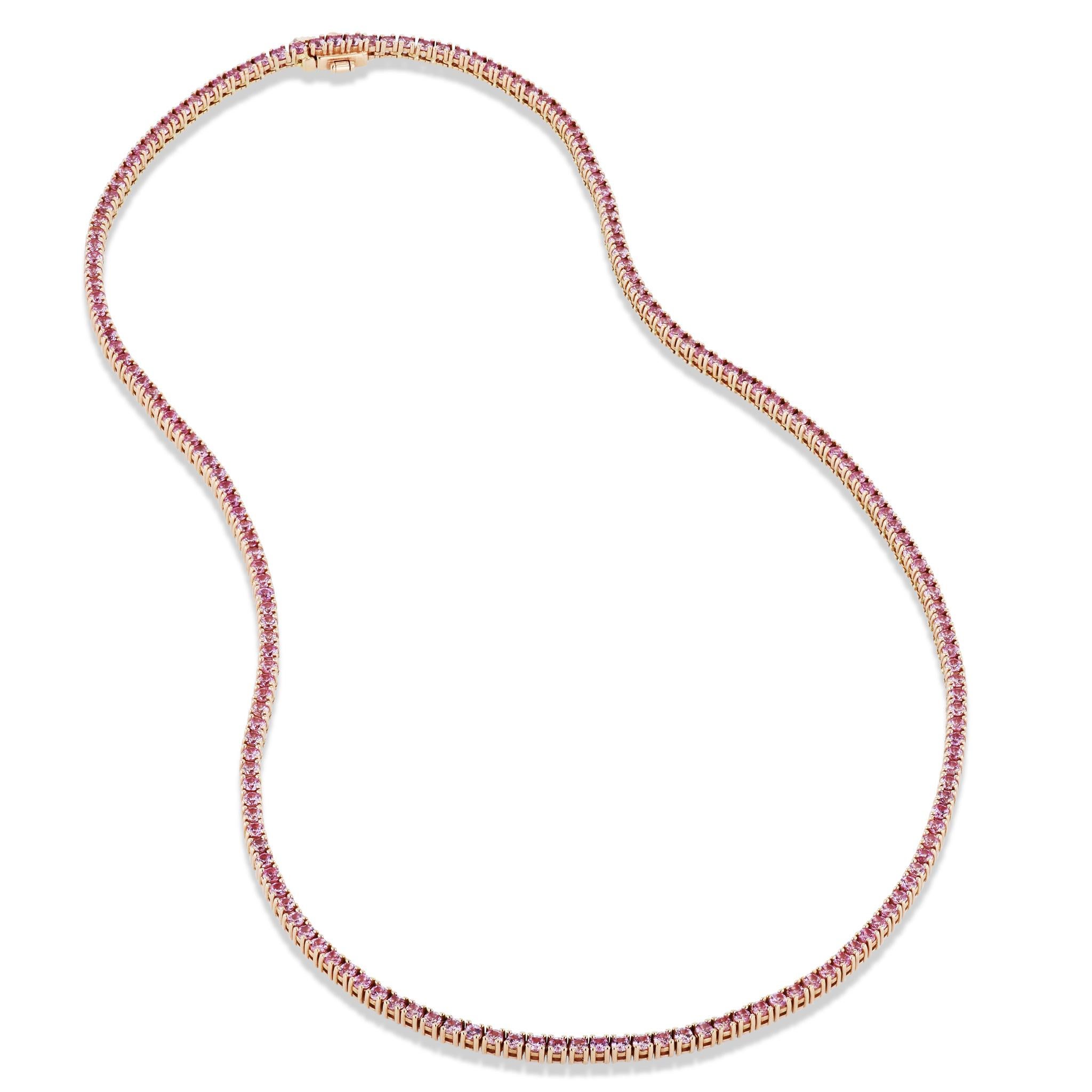 This gorgeous 18 karat rose gold, pink sapphire tennis necklace will take your breath away! 

This sassy tennis necklace features 184 pink sapphires that total 7.58 carats. It measures 17 inches in length. 

This beauty is handmade and one of a