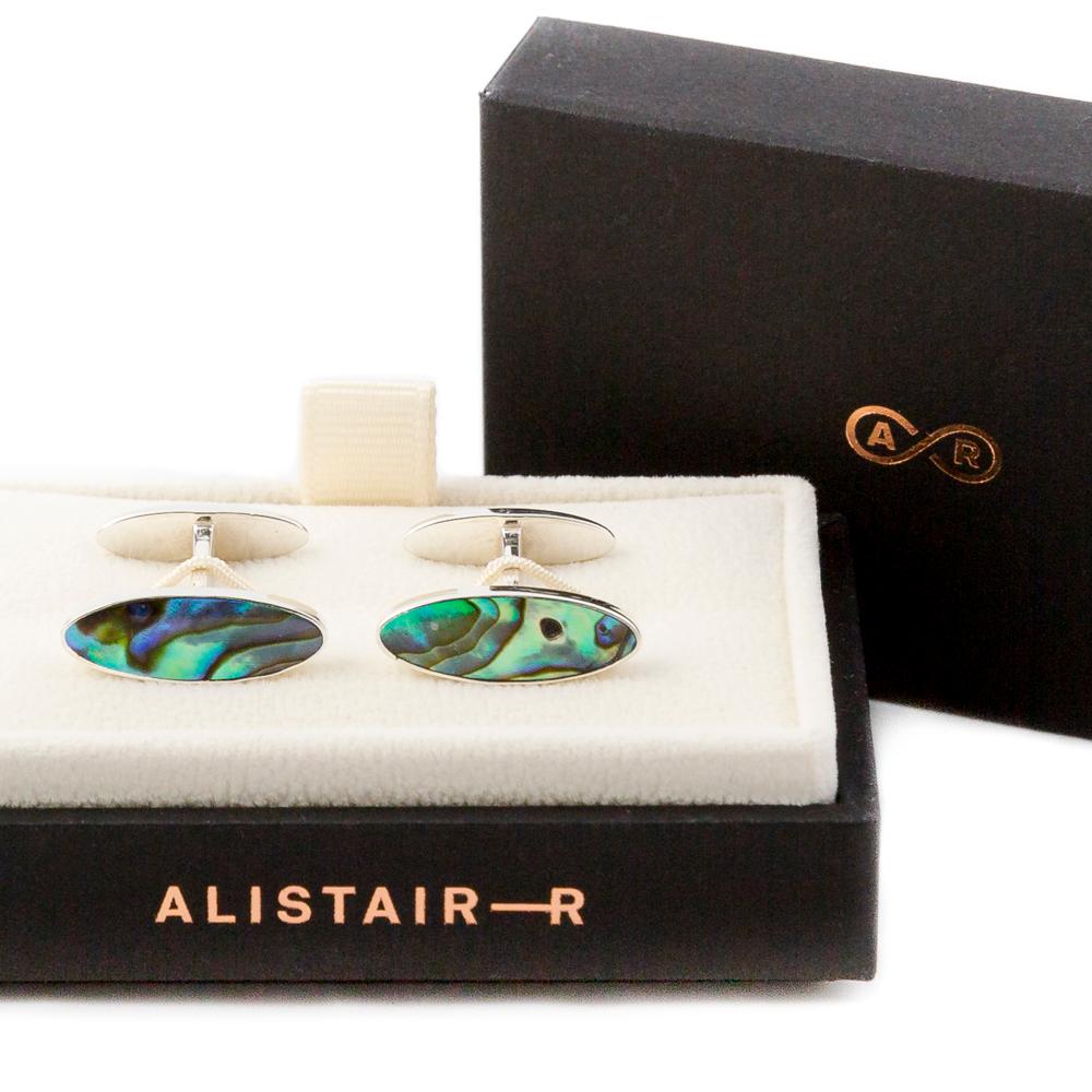 These unique pearlised iridescent Abalone cufflinks, like all of our modern luxury men's cufflinks, are handmade in our UK studio. They are made using a hand-carved piece of shell set into a classic walled setting in our unique A-frame link design.