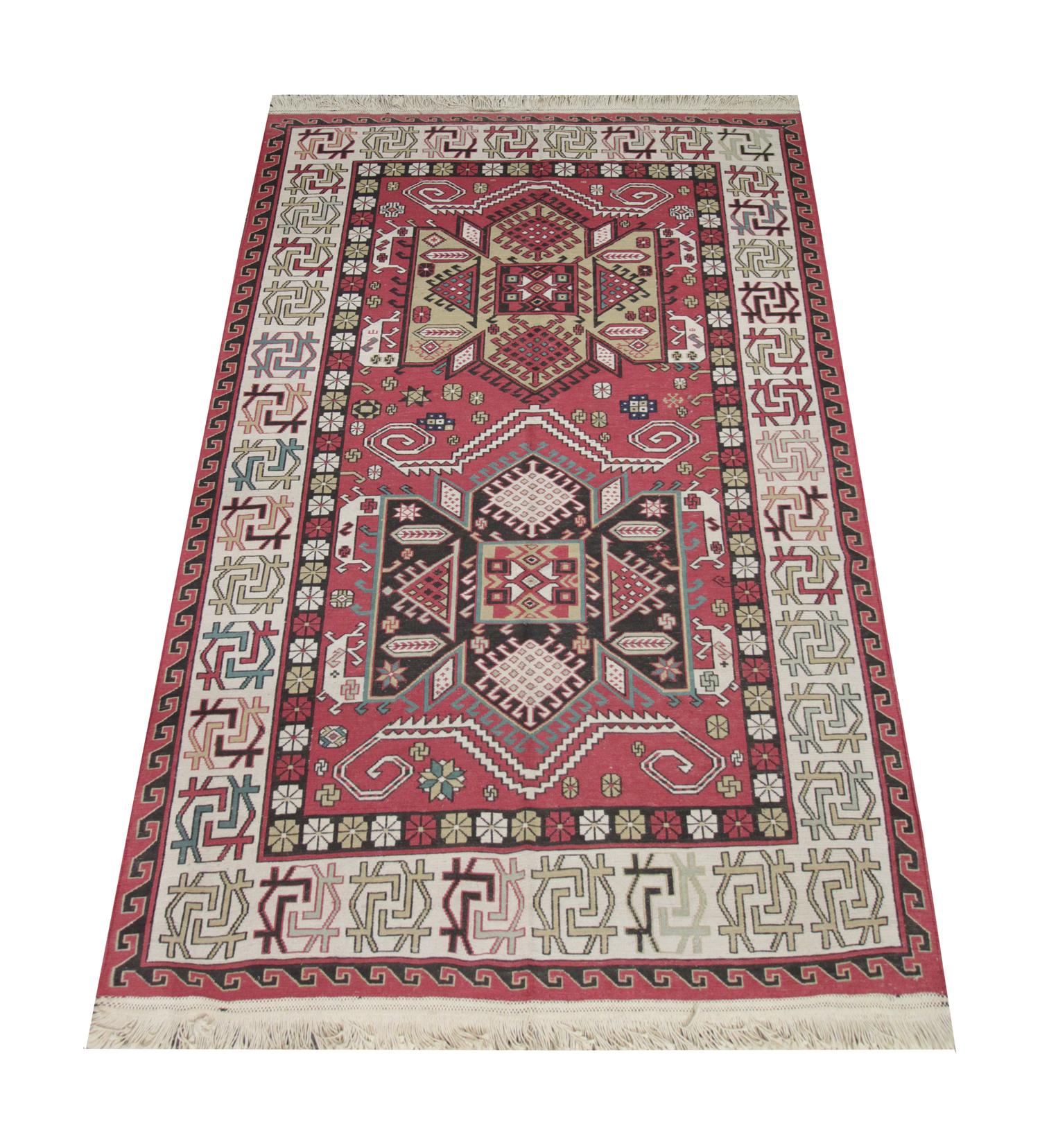 This fine wool area rug is a traditional flat-woven Soumak rug woven by hand in Afghanistan in the early 2000s. The piece is brand new and is in excellent condition. The central design has been woven in a rich red field with two large medallions