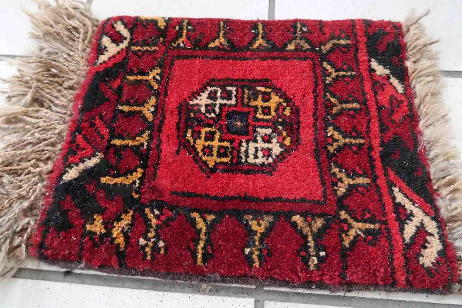 Handmade vintage Afghan Ersari mat in bright red shade. The rug is from the end of 20th century in original good condition. It can be used as a doll house rug.

-condition: original good,

-circa: 1970s,

-size: 0.8' x 1' (25cm x