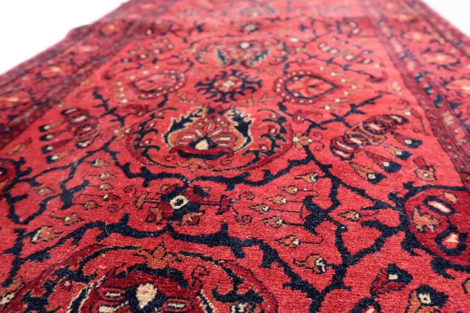 Handmade vintage Afghan Ersari runner in red color. The rug has been made in wool in the end of 20th century. It is in original good condition.

-condition: original good,

-circa: 1970s,

-size: 2.7' x 9.7' (84cm x 296cm),

-material: