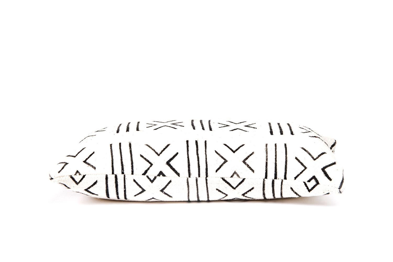 Mud cloth lumbar pillow

Our custom made authentic African mud cloth zippered pillow covers have a down fill. Every piece has a unique structure, with markings appearing as a result of the hand made fabric.

Pillow Measures: 22” W x 10” T.