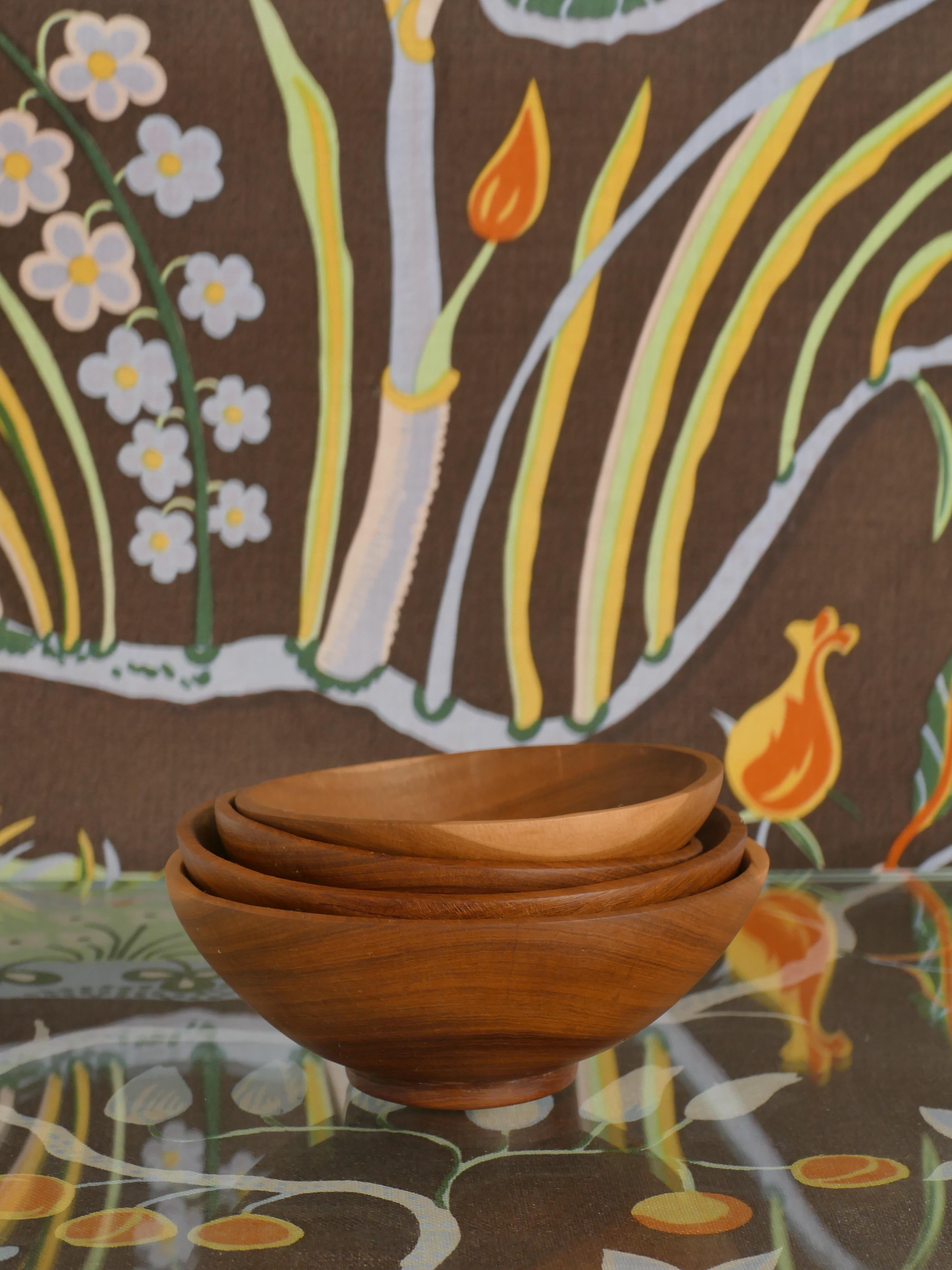 A very stylish mid-century modern four acacia wood bowls. Designed and handmade in Mozambique.
Whether displayed as standalone art pieces or used practically to hold candy, nuts,decorative accents, or even as a conversation-starting centerpiece,