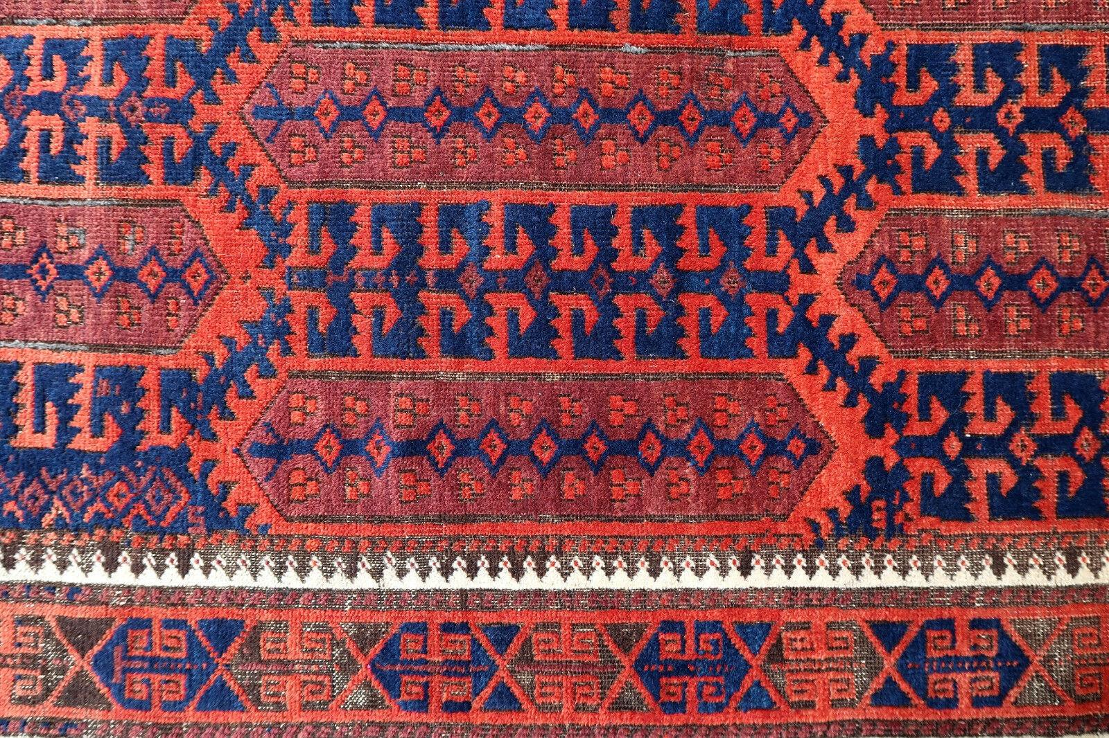 Handmade antique Baluch rug from Afghanistan in original condition, it has some signs of age. The rug is from the beginning of 20th century.

- Condition: Original, some signs of age,

- circa 1900s,

- Size: 2.9' x 5.3' (90cm x 163cm),

-
