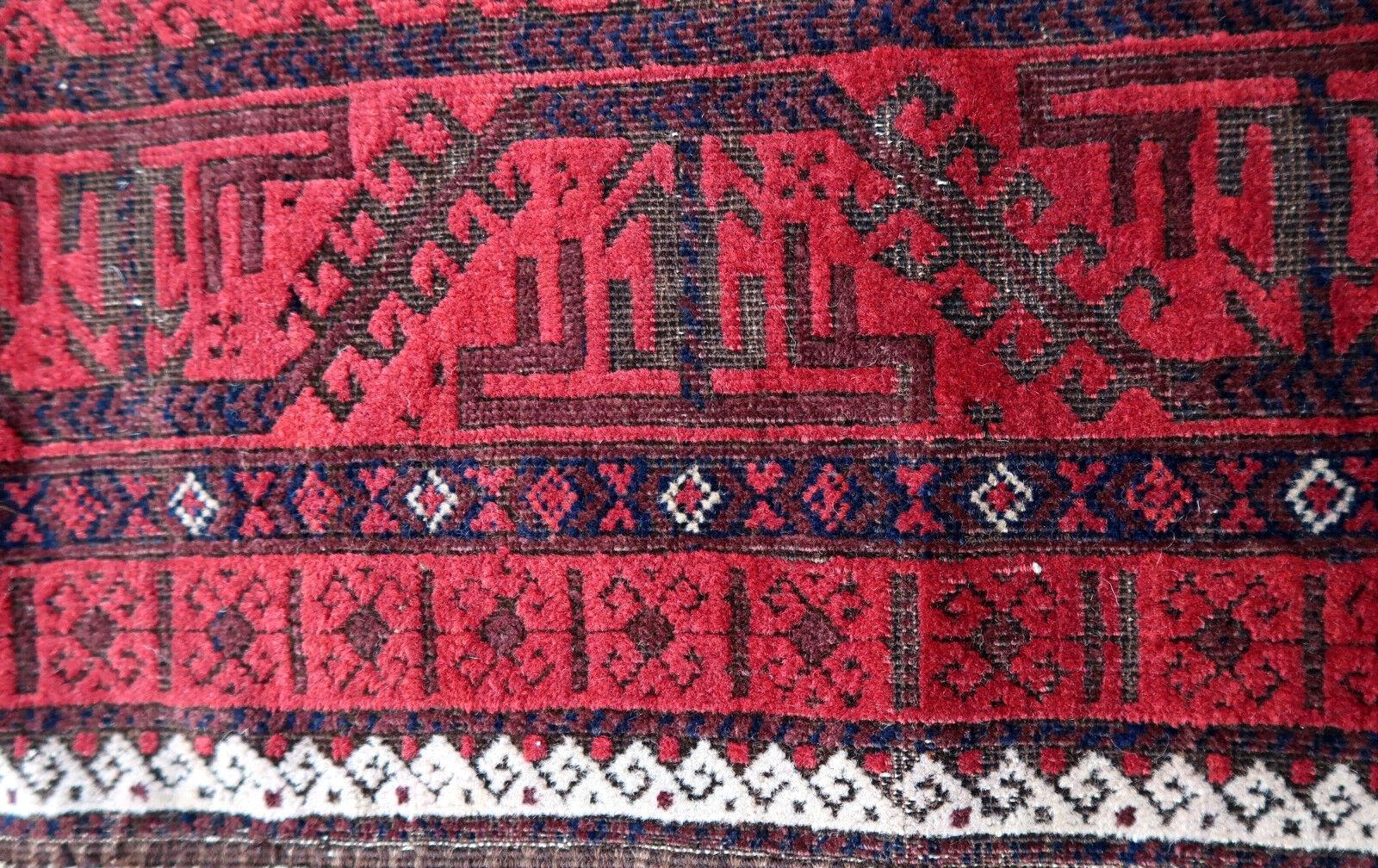 Handmade antique Baluch rug from Central Asia in original condition, it has some age wear and low pile. The rug is from the beginning of 20th century.

-Condition: Original, age wear, low pile,

-circa 1900s,

-Size: 3.3' x 6.2' (100cm x