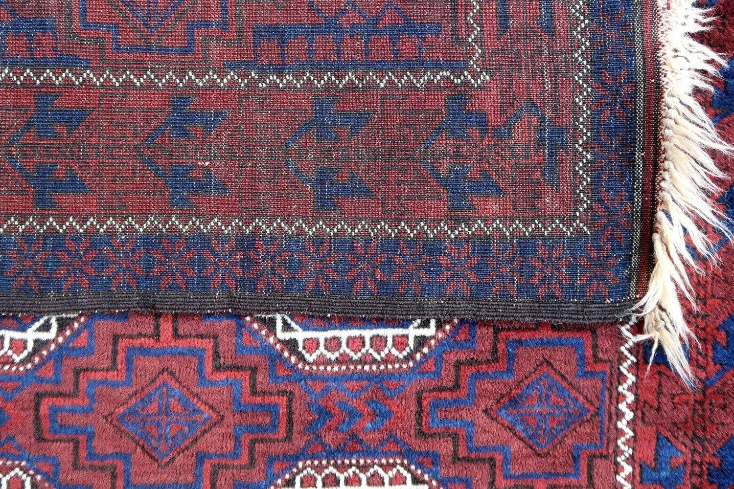 Handmade antique Baluch rug from Central Asia in original good condition. The rug is from the beginning of 20th century.

- Condition: original good,

- circa: 1900s,

- Size: 3.9' x 5.6' (120cm x 170cm),

- Material: wool,

- Country of