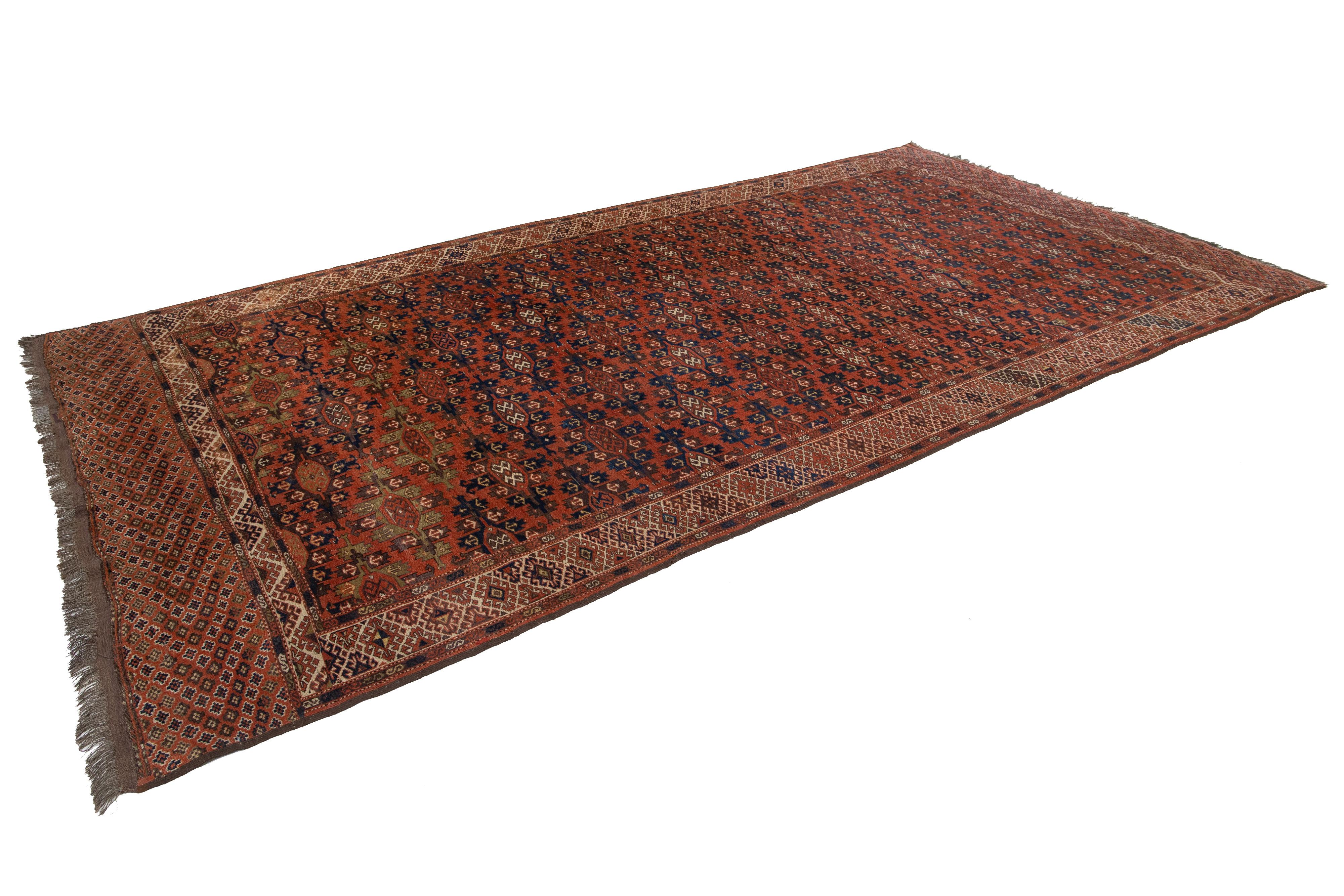 Afghan Tapis afghan Yamoud ancien fait à la main en laine rouillée avec motif sur toute sa surface en vente