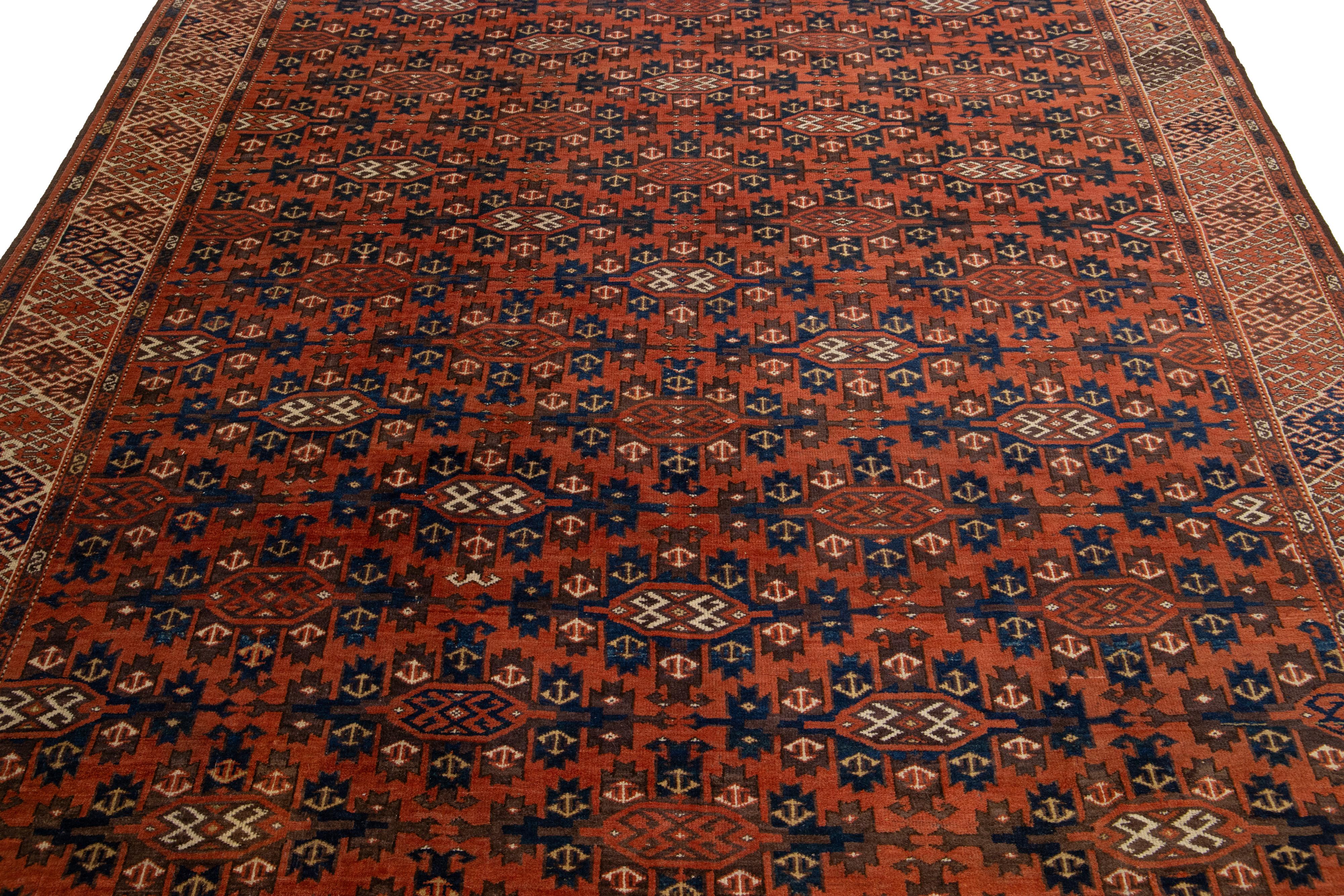 Laine Tapis afghan Yamoud ancien fait à la main en laine rouillée avec motif sur toute sa surface en vente