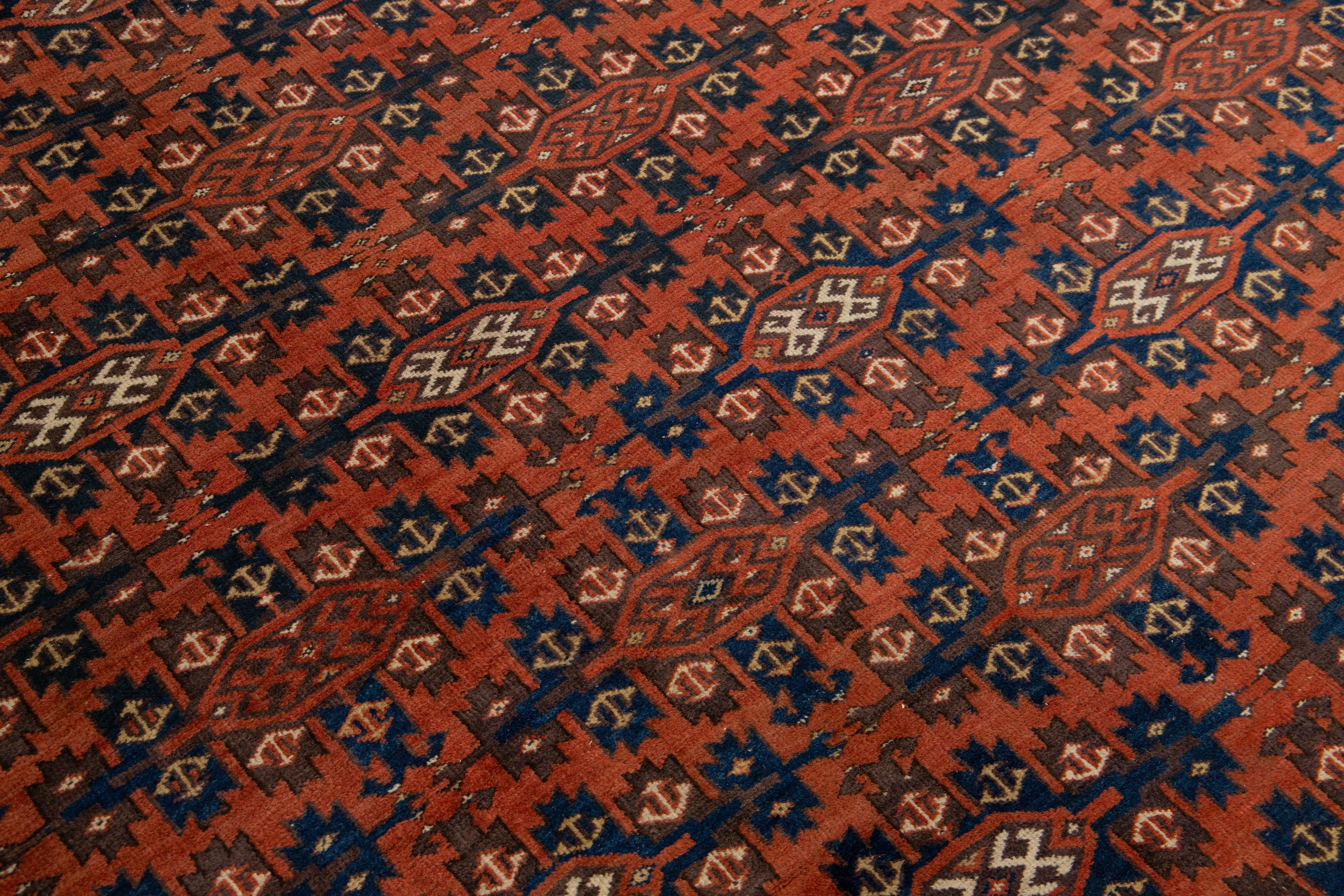 Tapis afghan Yamoud ancien fait à la main en laine rouillée avec motif sur toute sa surface en vente 1