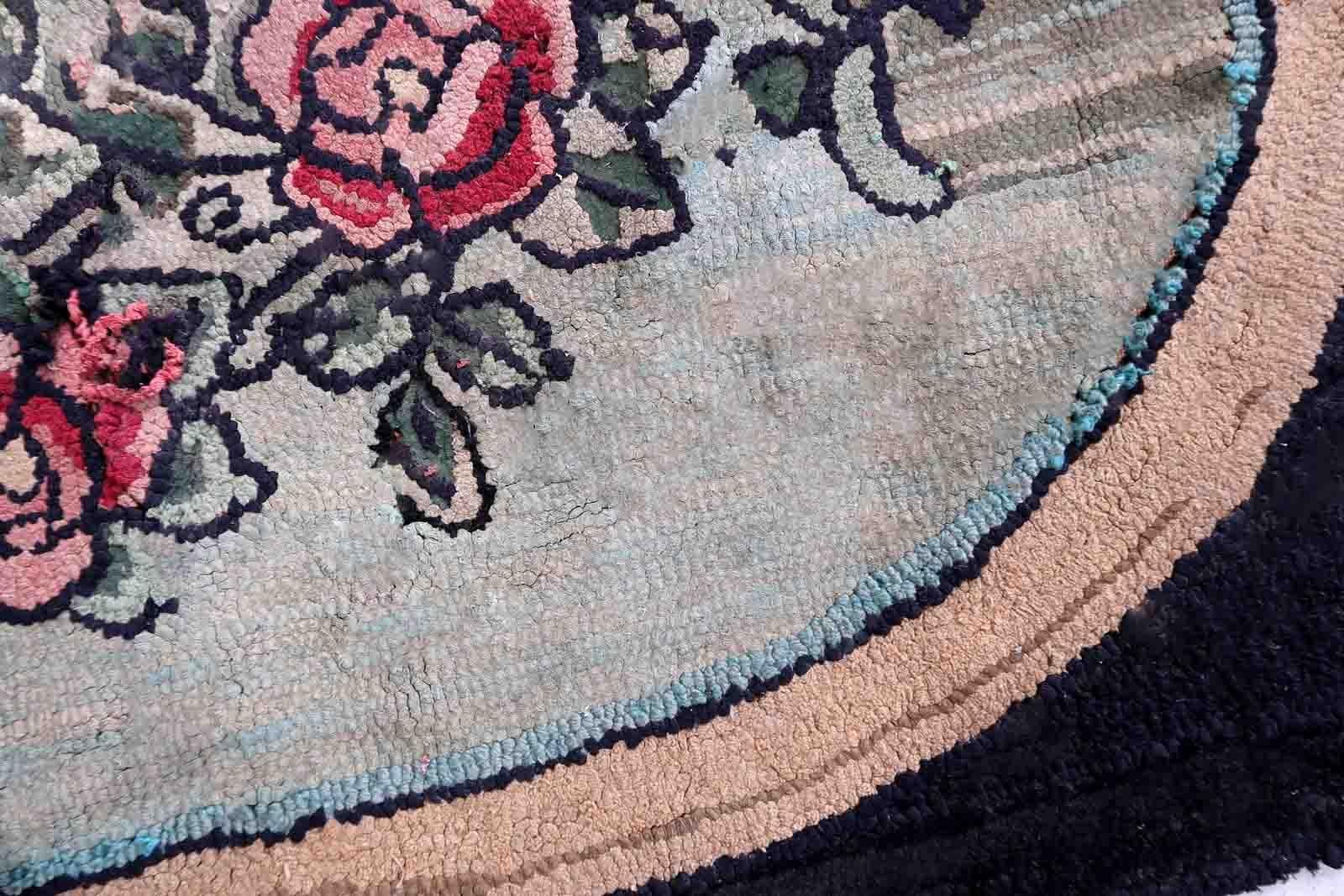 Handmade antique American Hooked rug in floral design. The rug is from the beginning of 20th century. It has some old restorations and discolorations.

-condition: restored, discolorations,

-circa: 1900s,

-size: 2.4' x 3.4' (74cm x