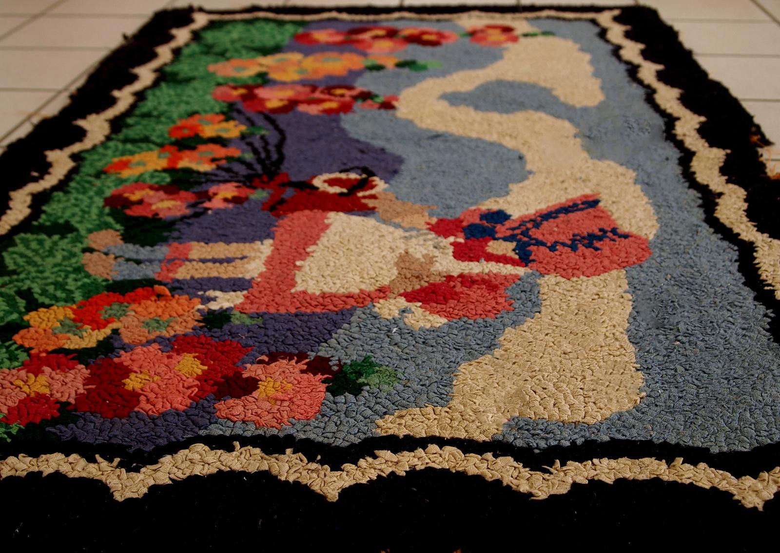 Handmade antique American hooked rug in pictorial design. The rug is from the beginning of 20th century in good condition.

-Condition: Good,

-circa 1920s,

-Size: 2.6' x 4.1' (79cm x 125cm),

-Material: wool,

-Country of origin: