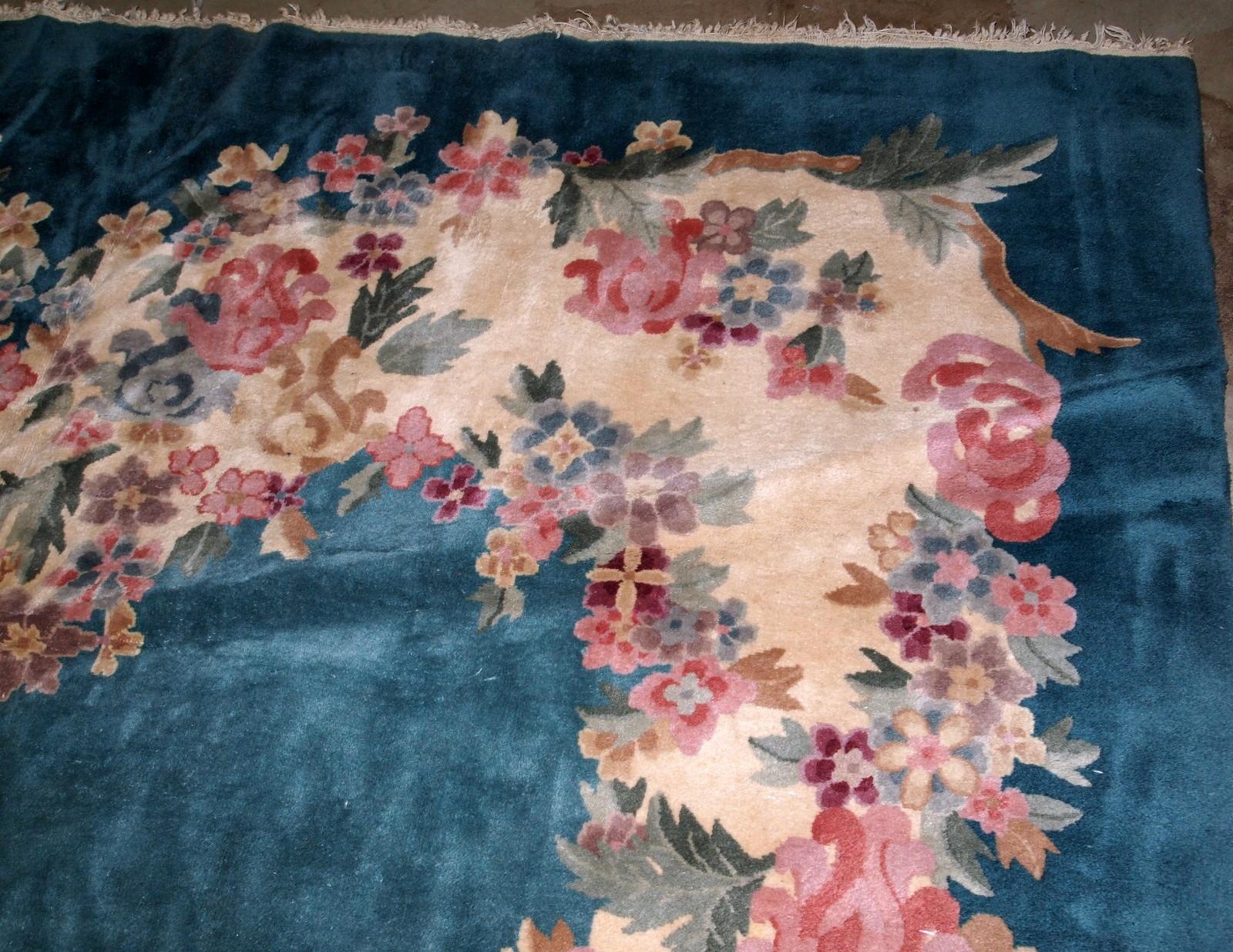 Handmade antique Art Deco Chinese rug in turquoise color. The rug decorated in Art Deco floral design. It is in original good condition.

?-condition: original good,

-circa 1920s,

-size: 8.9' x 11.2' (271cm x 341cm),

-material: